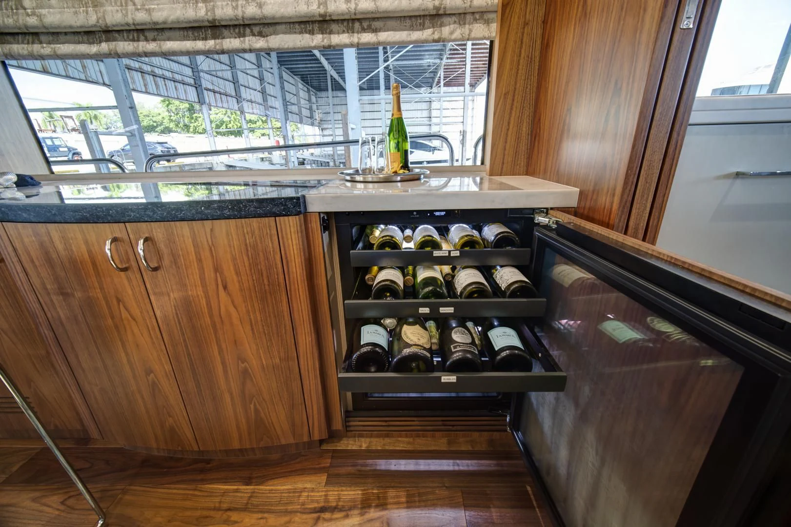 a kitchen with a glass door aboard 'S NOON SOMEWHERE Yacht for Sale
