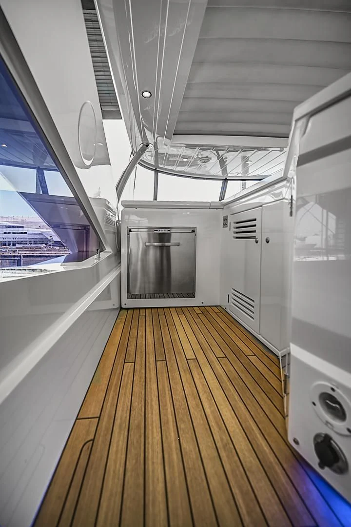 a room with a large window and a large metal door aboard 'S NOON SOMEWHERE Yacht for Sale