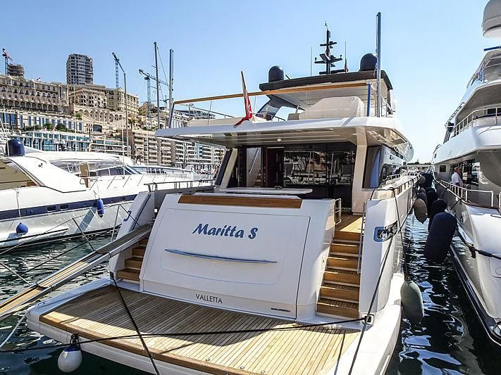a boat docked at a pier aboard NEVER SAY NEVER Yacht for Sale
