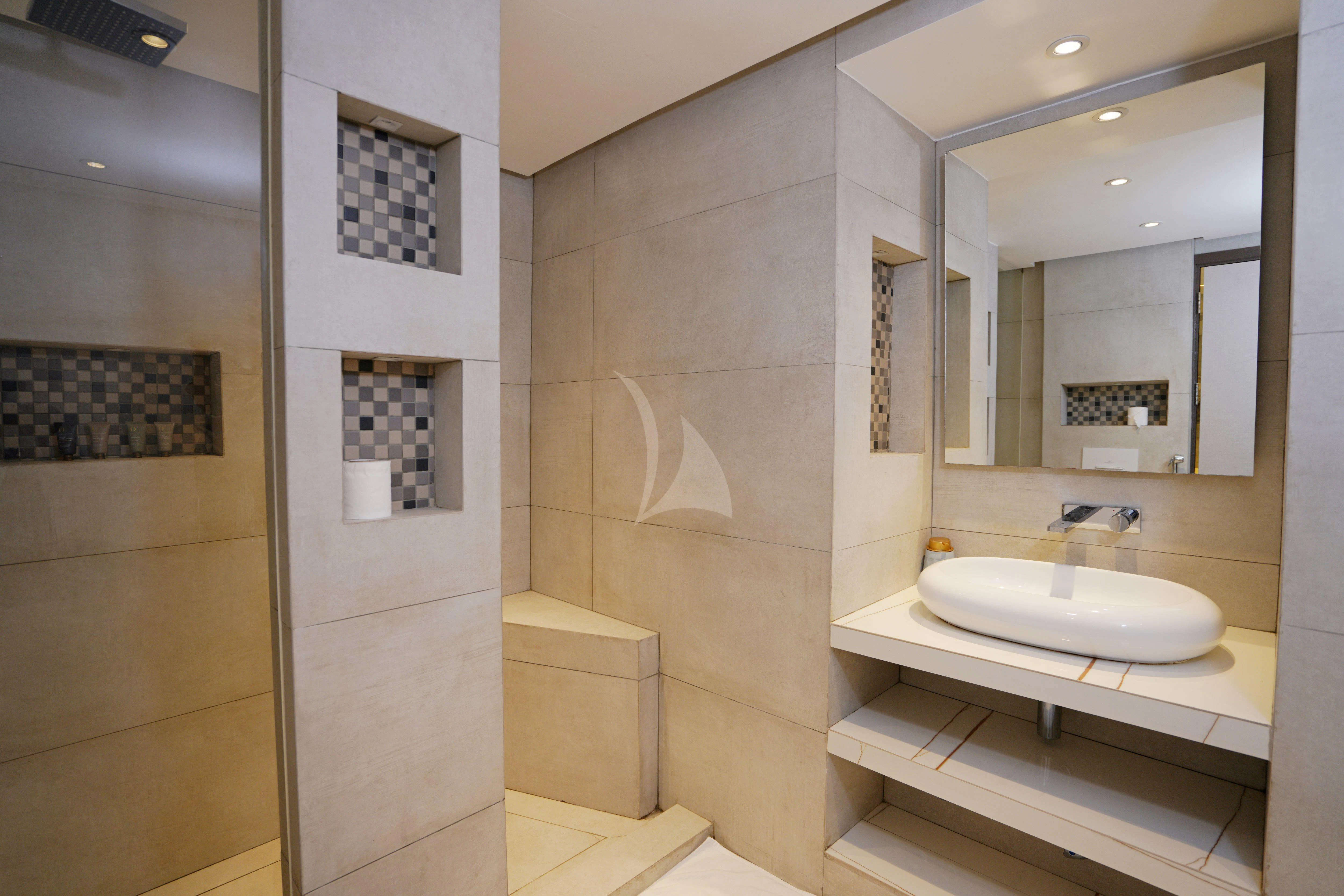 a bathroom with a sink and mirror aboard ARK NOBLE Yacht for Sale