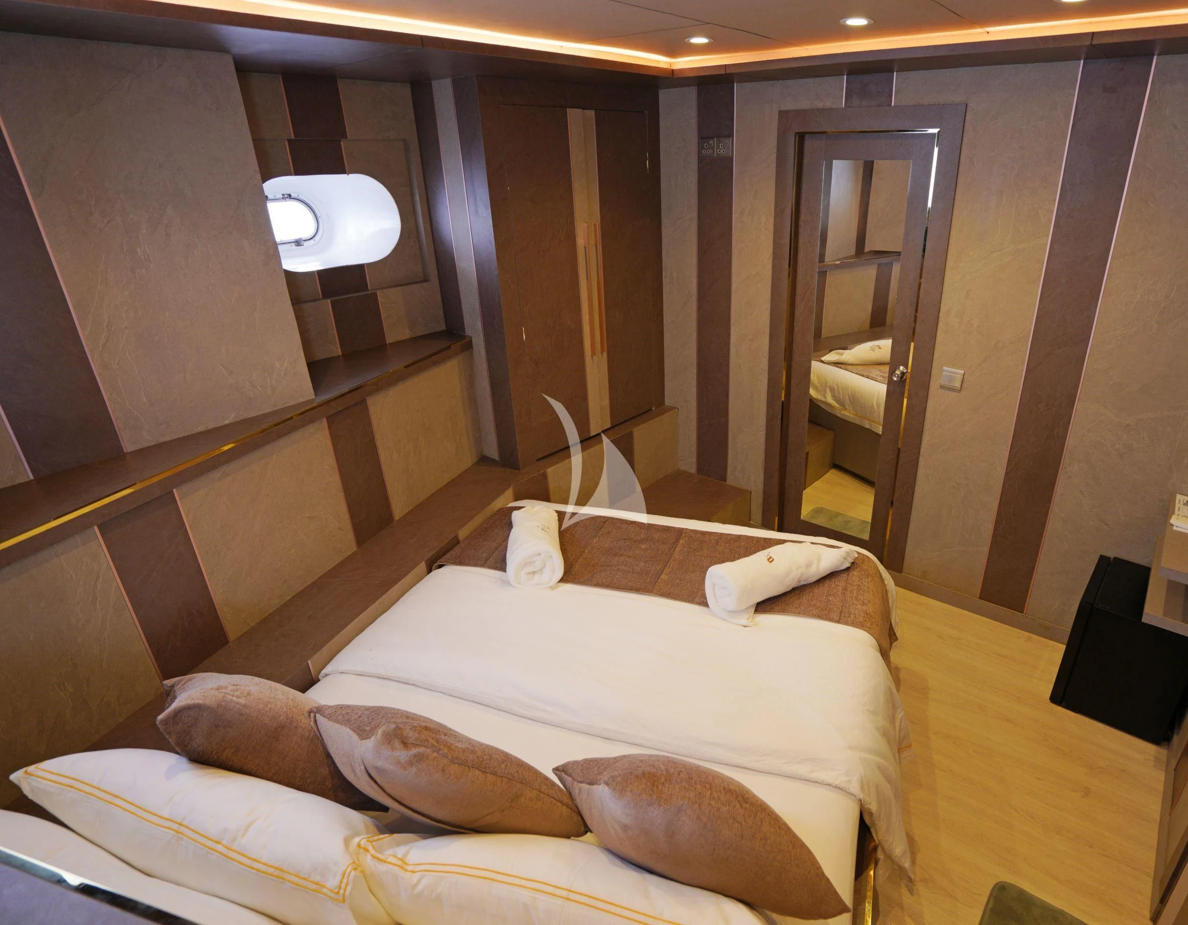 a room with a bed and a staircase aboard ARK NOBLE Yacht for Sale