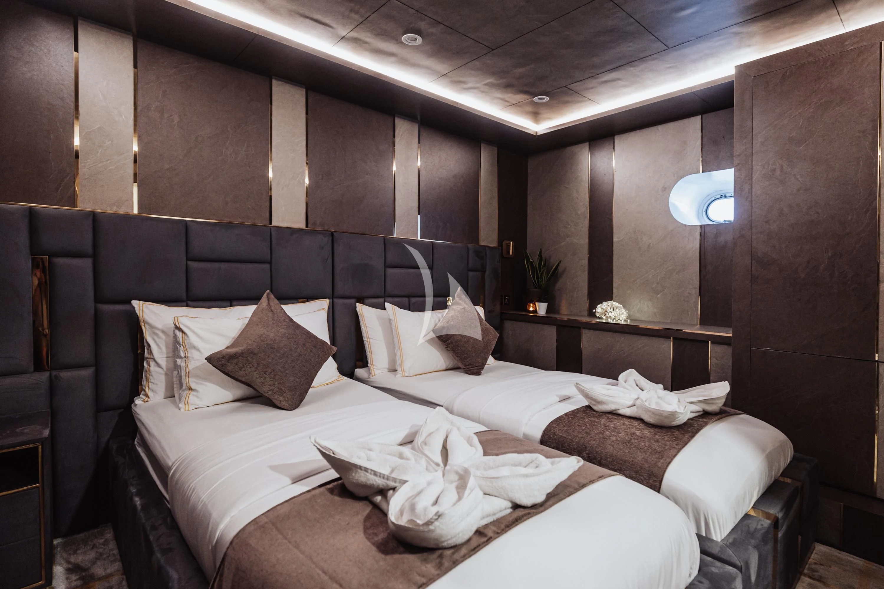 a room with a bed and a table aboard ARK NOBLE Yacht for Sale