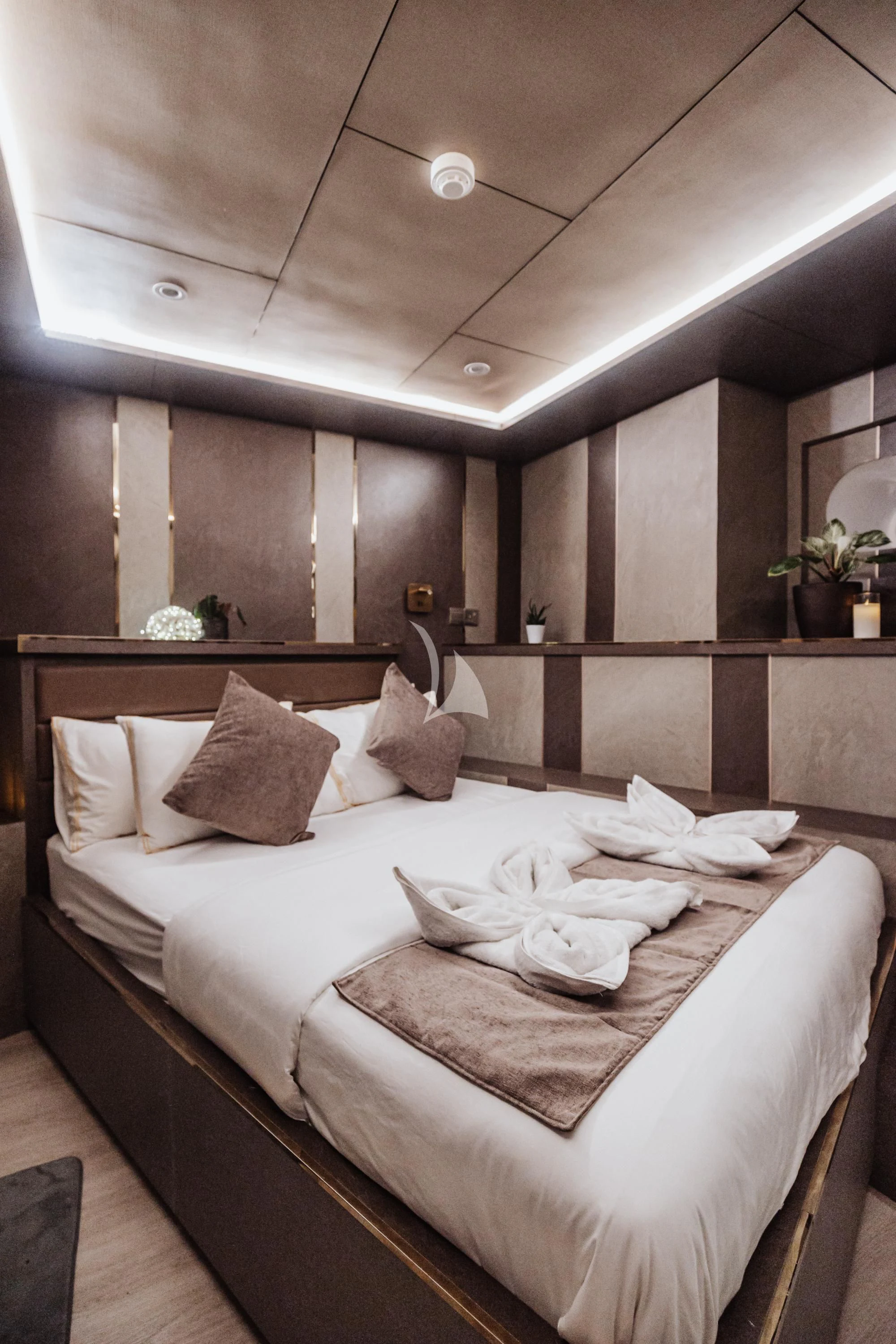 a bed with white sheets aboard ARK NOBLE Yacht for Sale