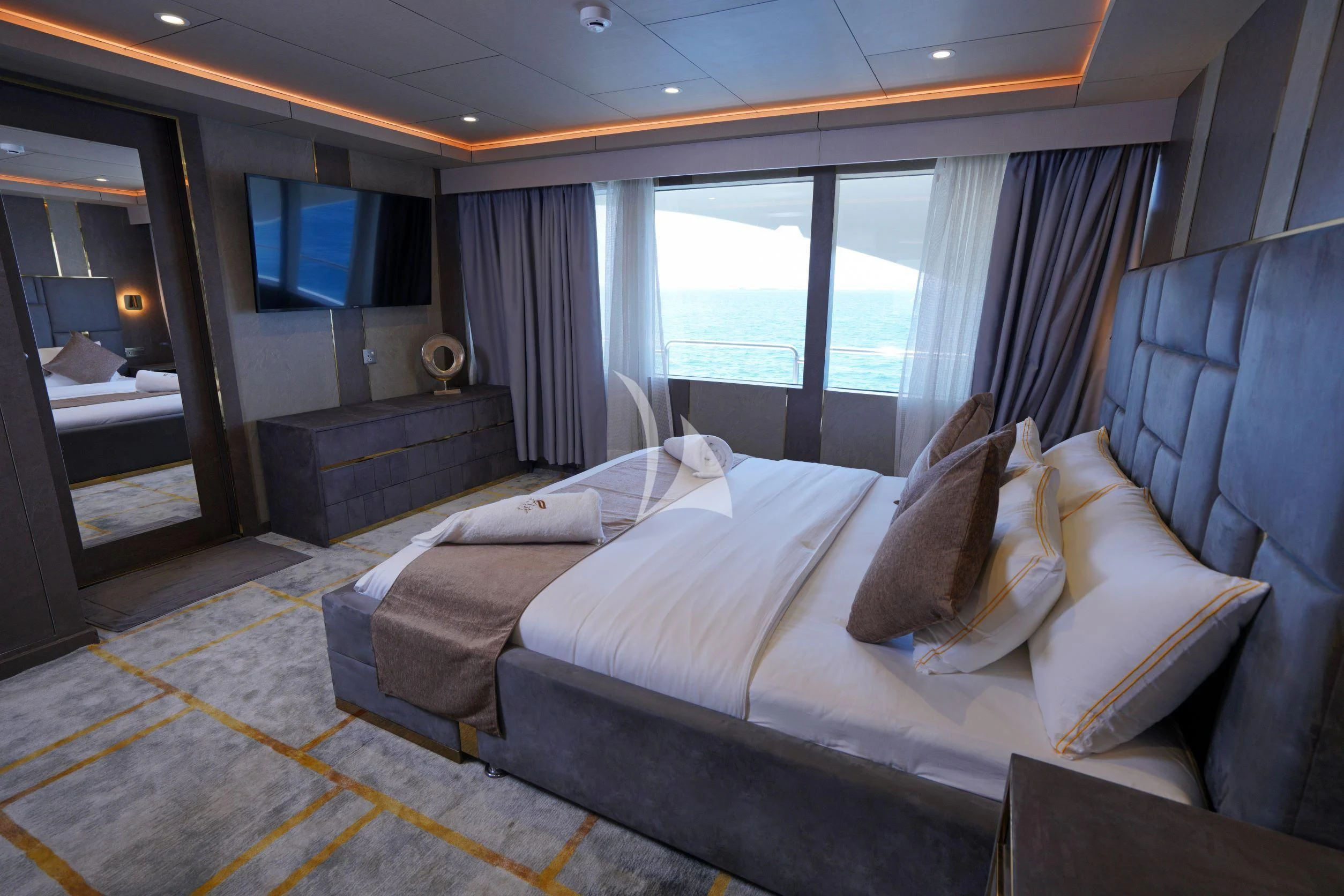a room with a bed and a tv aboard ARK NOBLE Yacht for Sale
