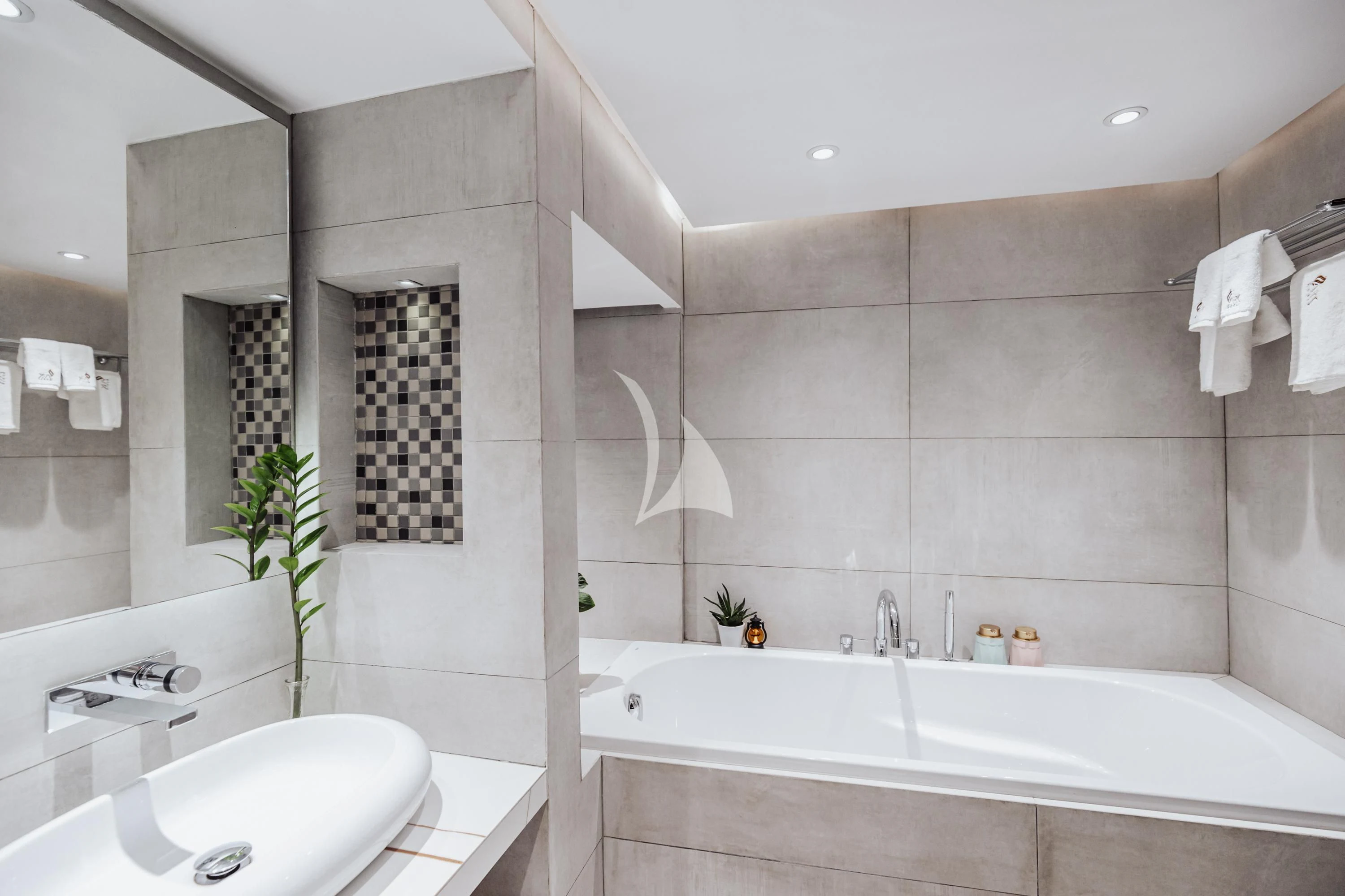 a bathroom with a tub sink and a mirror aboard ARK NOBLE Yacht for Sale