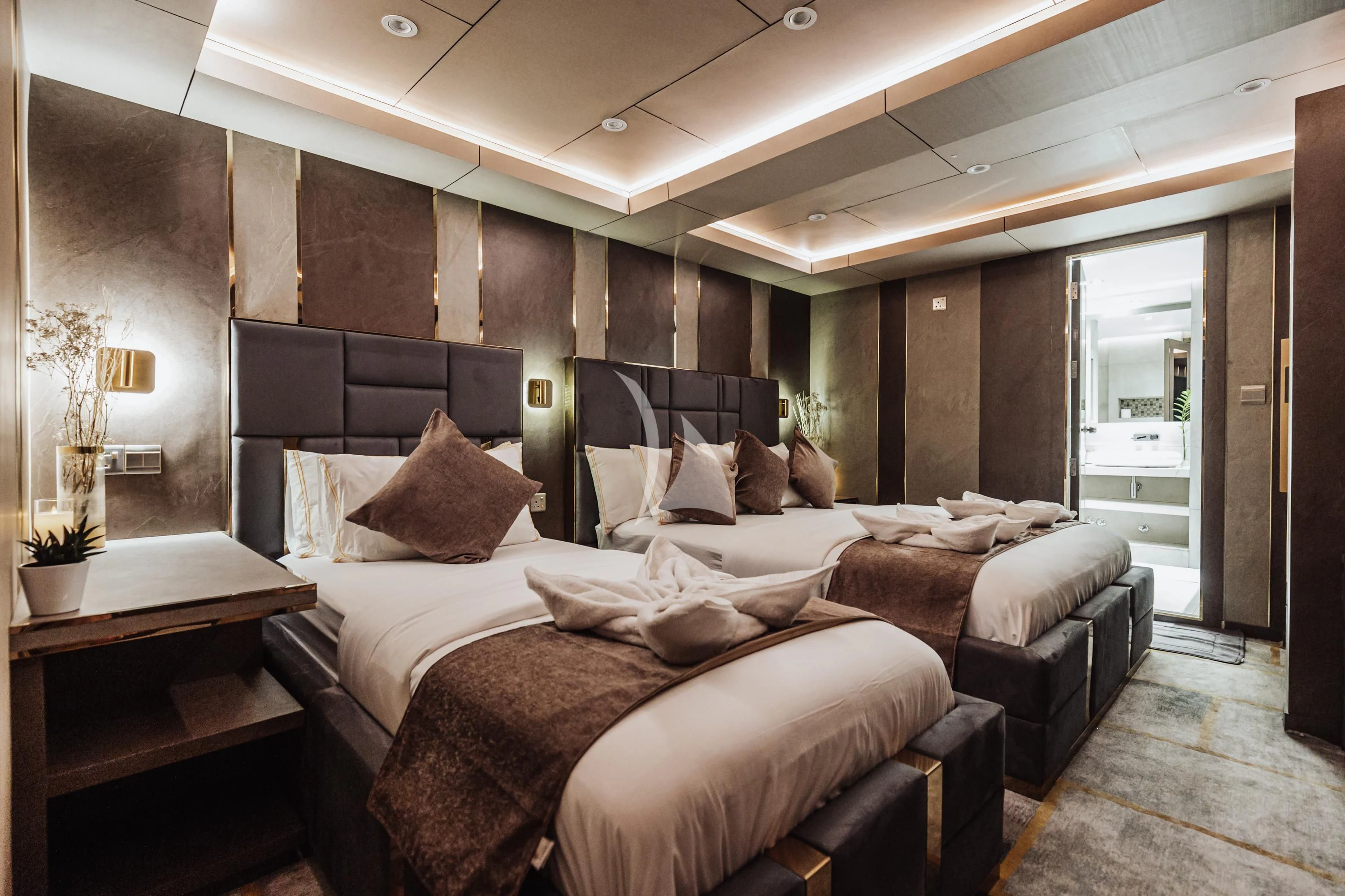 a room with a bed and a table aboard ARK NOBLE Yacht for Sale