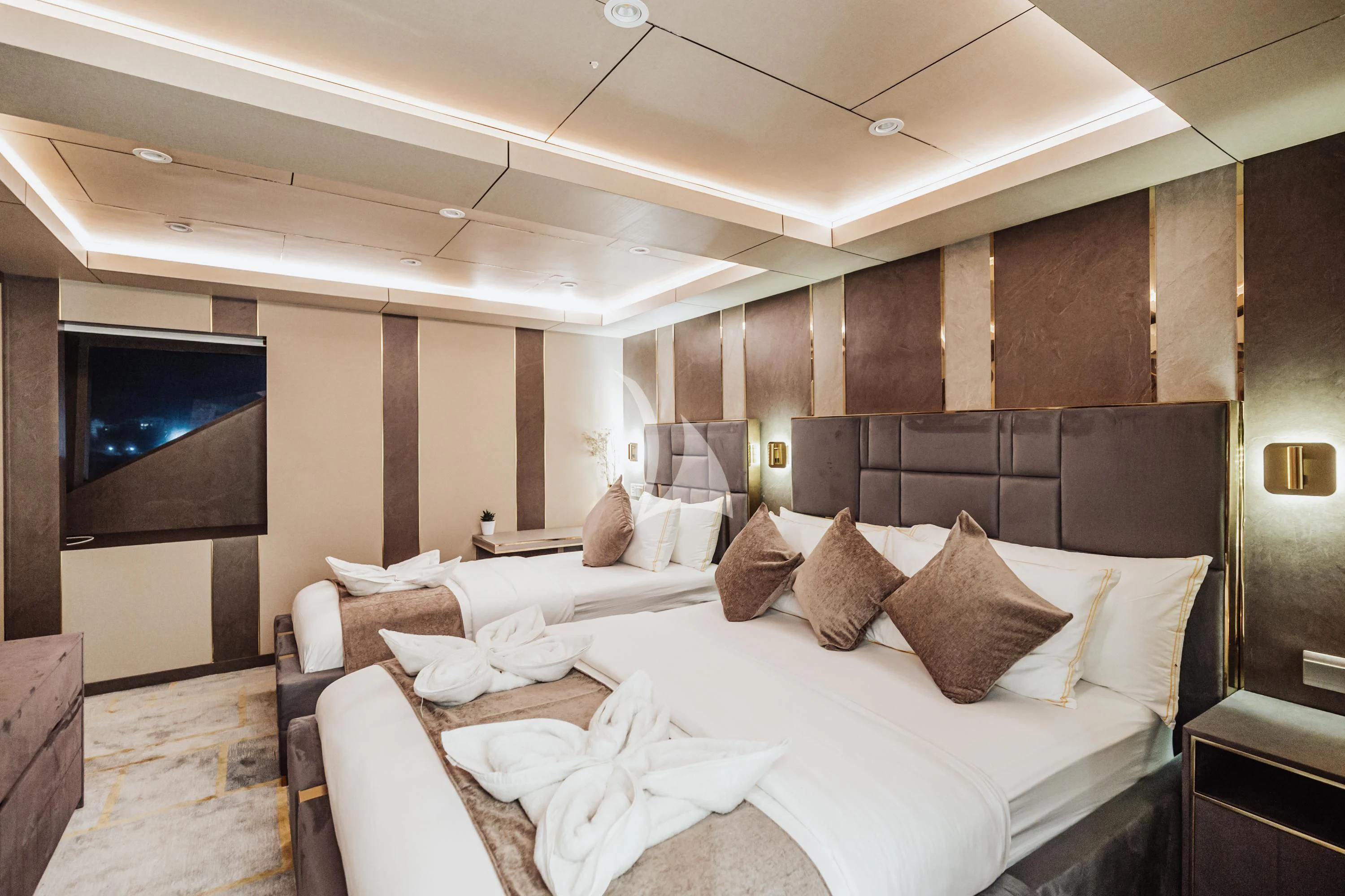 a room with a bed and a tv aboard ARK NOBLE Yacht for Sale