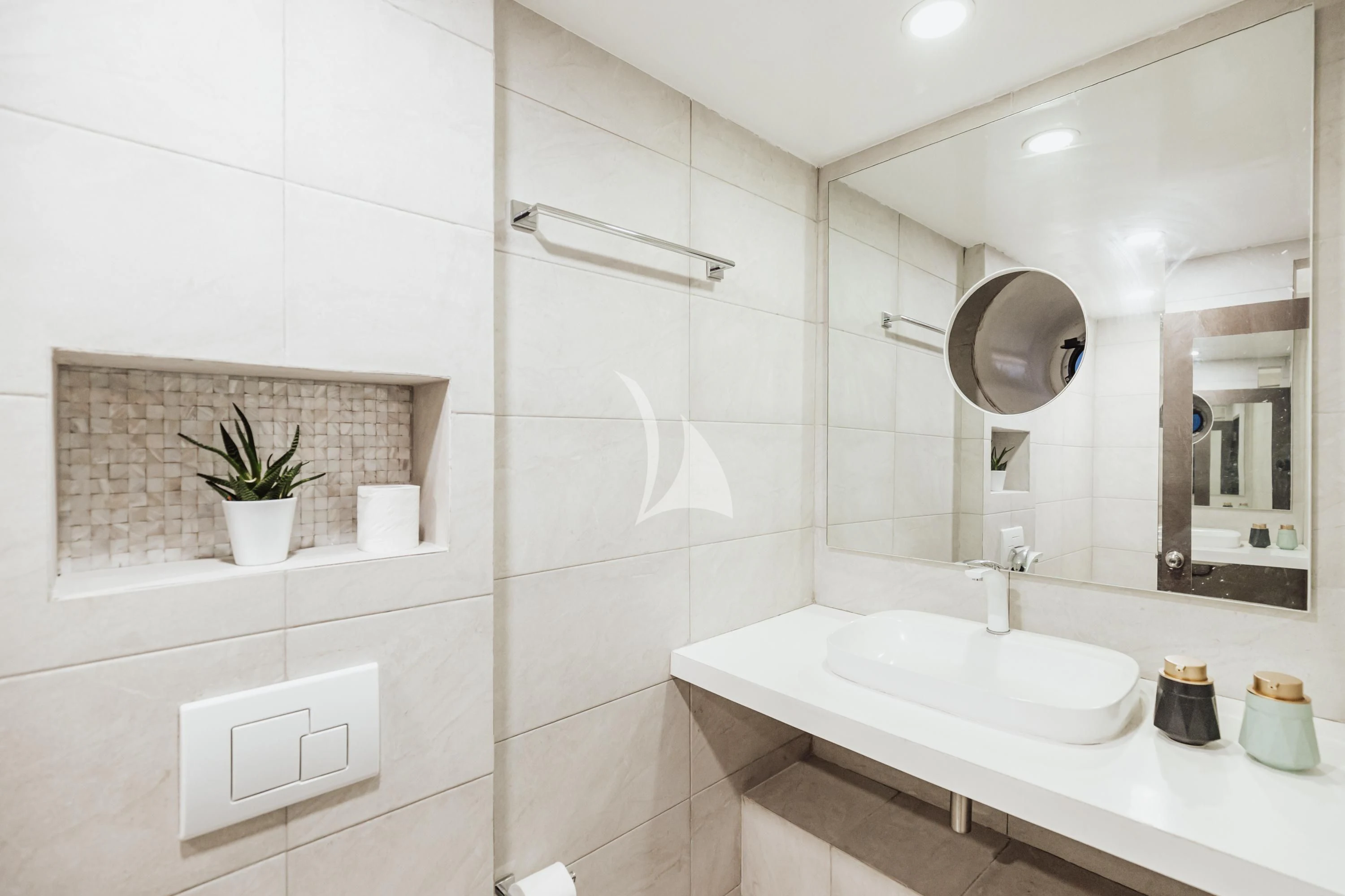 a bathroom with a large mirror aboard ARK NOBLE Yacht for Sale