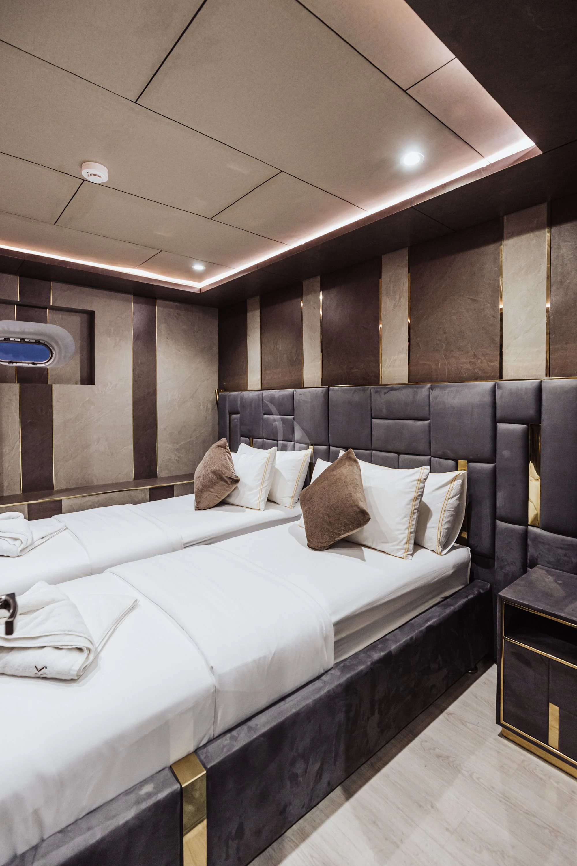 a room with a bed and a mirror aboard ARK NOBLE Yacht for Sale