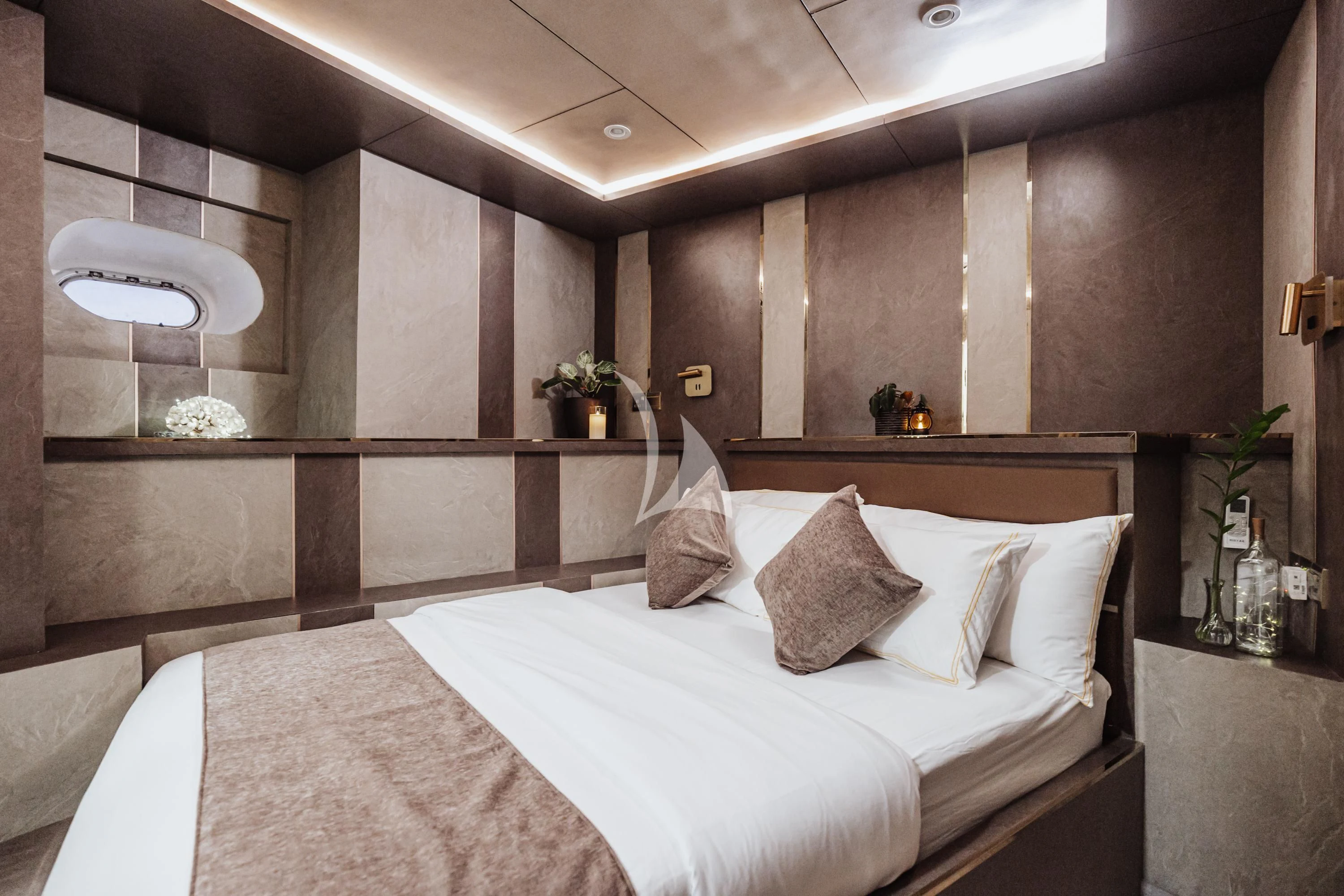 a modern bedroom with a large bed aboard ARK NOBLE Yacht for Sale