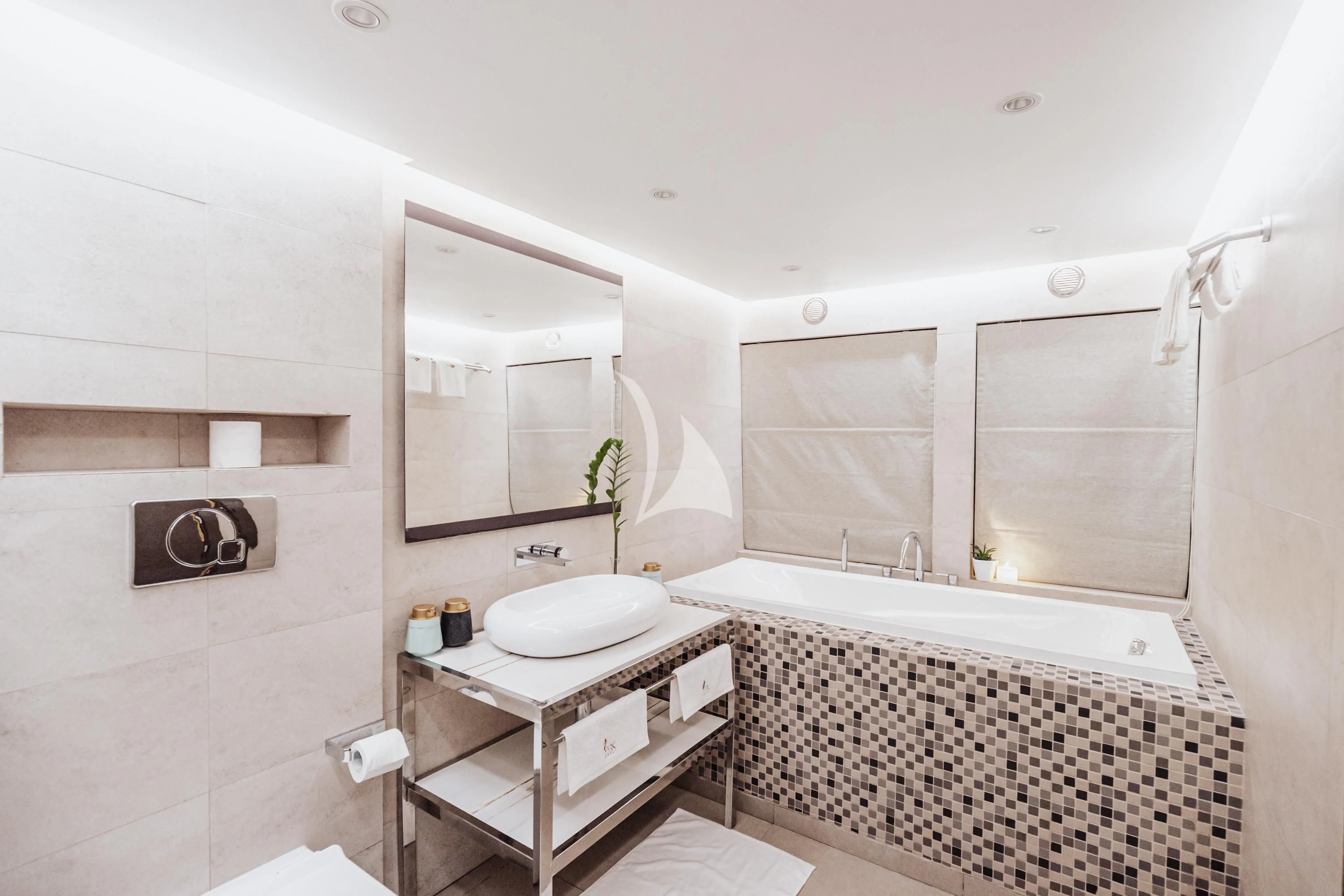 a bathroom with a tub sink and a mirror aboard ARK NOBLE Yacht for Sale