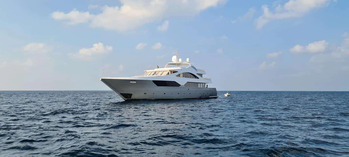 a white boat in the water aboard ARK NOBLE Yacht for Sale