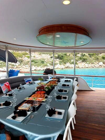 a table with food on it aboard QUESTA VITA Yacht for Sale