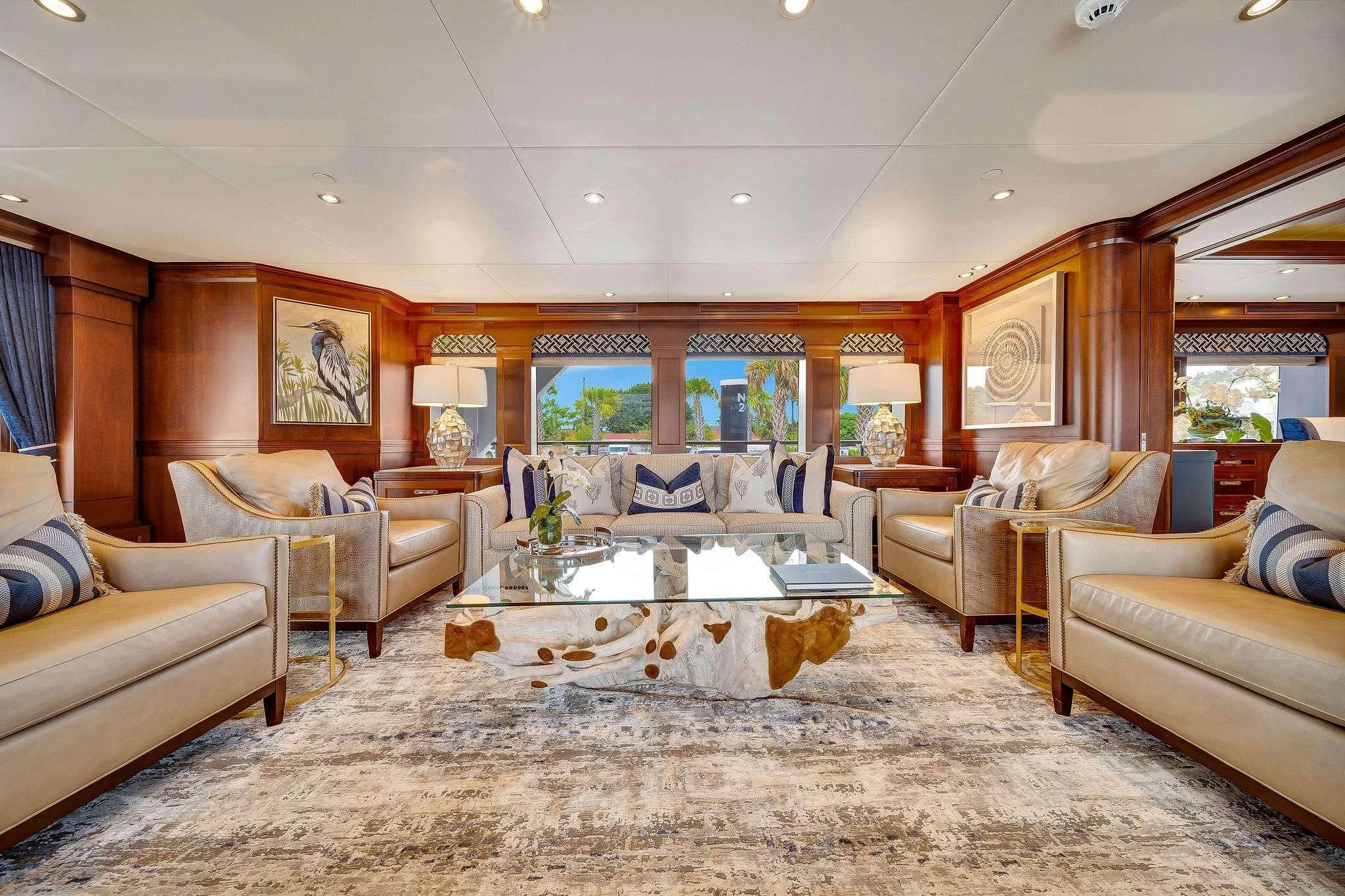 a living room with a large sofa aboard VALHALLA Yacht for Sale