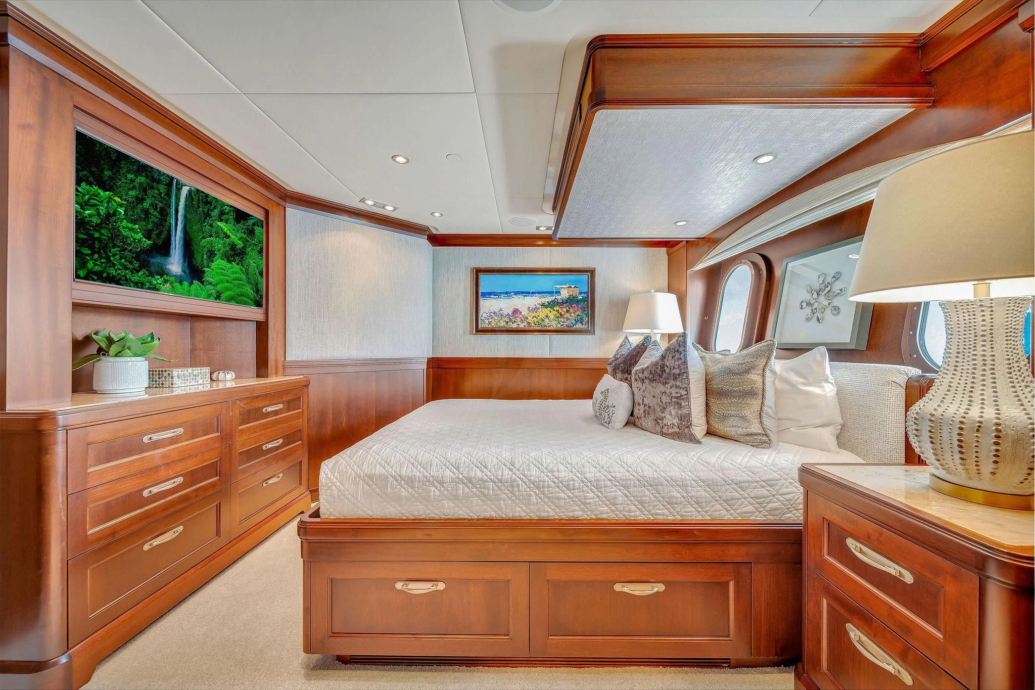 a bedroom with a bed and a window aboard VALHALLA Yacht for Sale