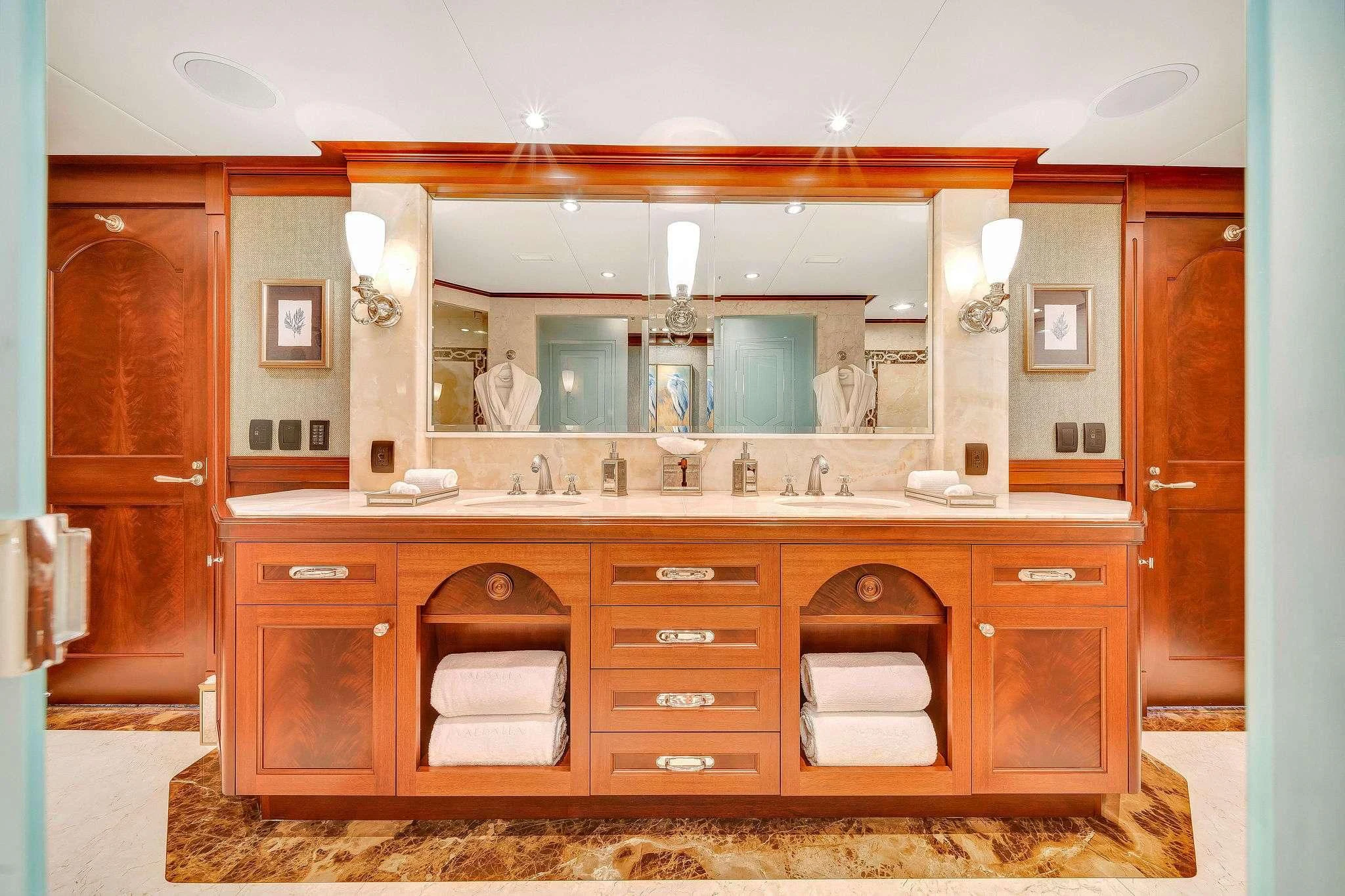 a bathroom with a large mirror aboard VALHALLA Yacht for Sale