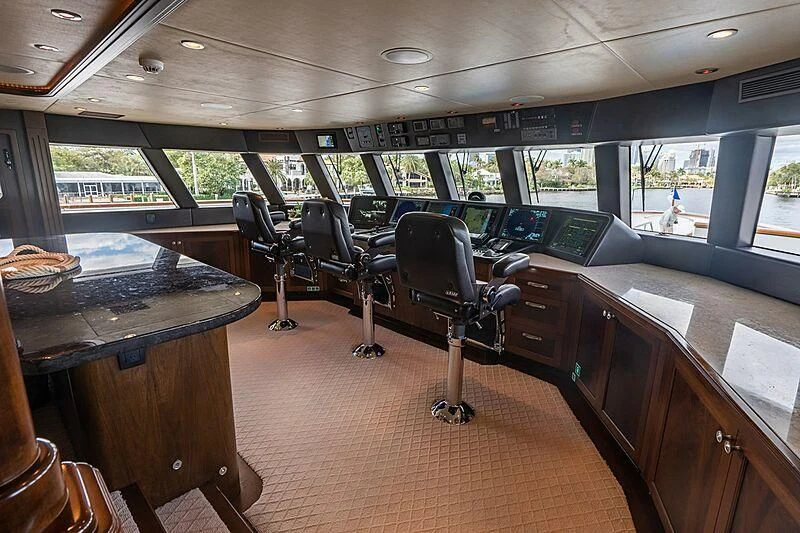 a room with a table and chairs aboard VALHALLA Yacht for Sale