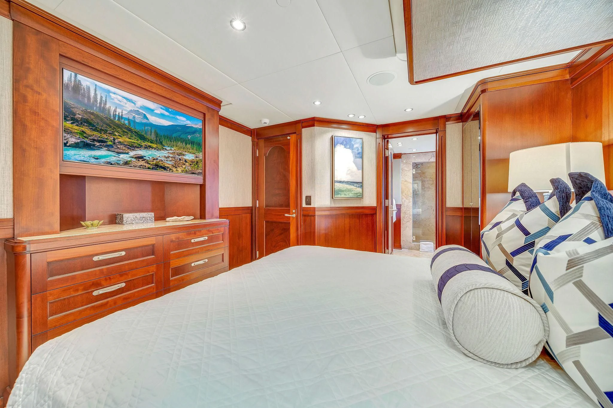 a bedroom with a bed and a dresser aboard VALHALLA Yacht for Sale