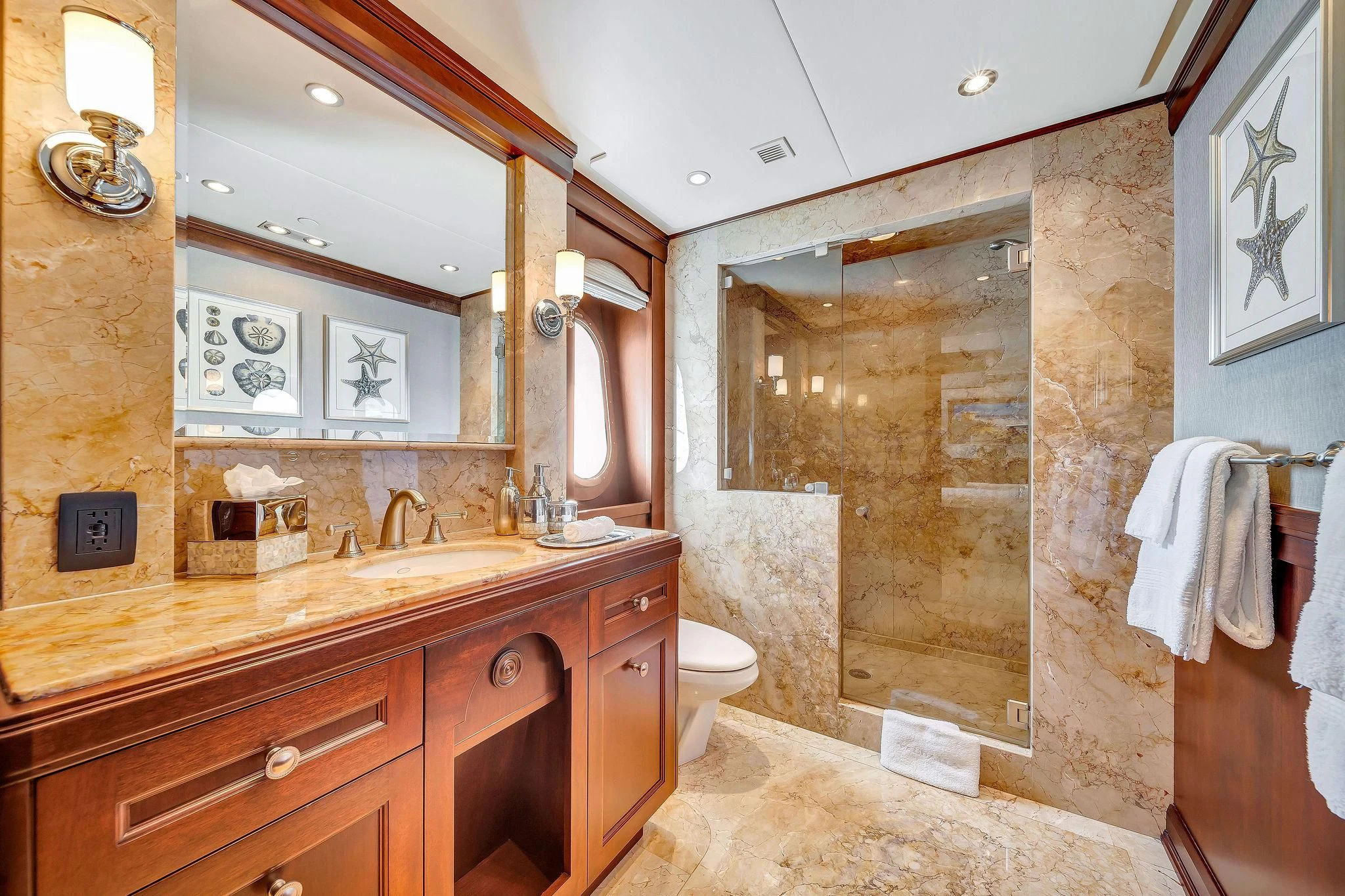 a bathroom with a glass shower aboard VALHALLA Yacht for Sale