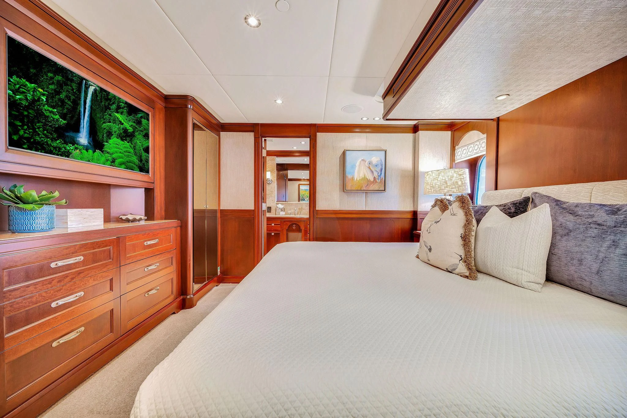 a bed with pillows and a window aboard VALHALLA Yacht for Sale