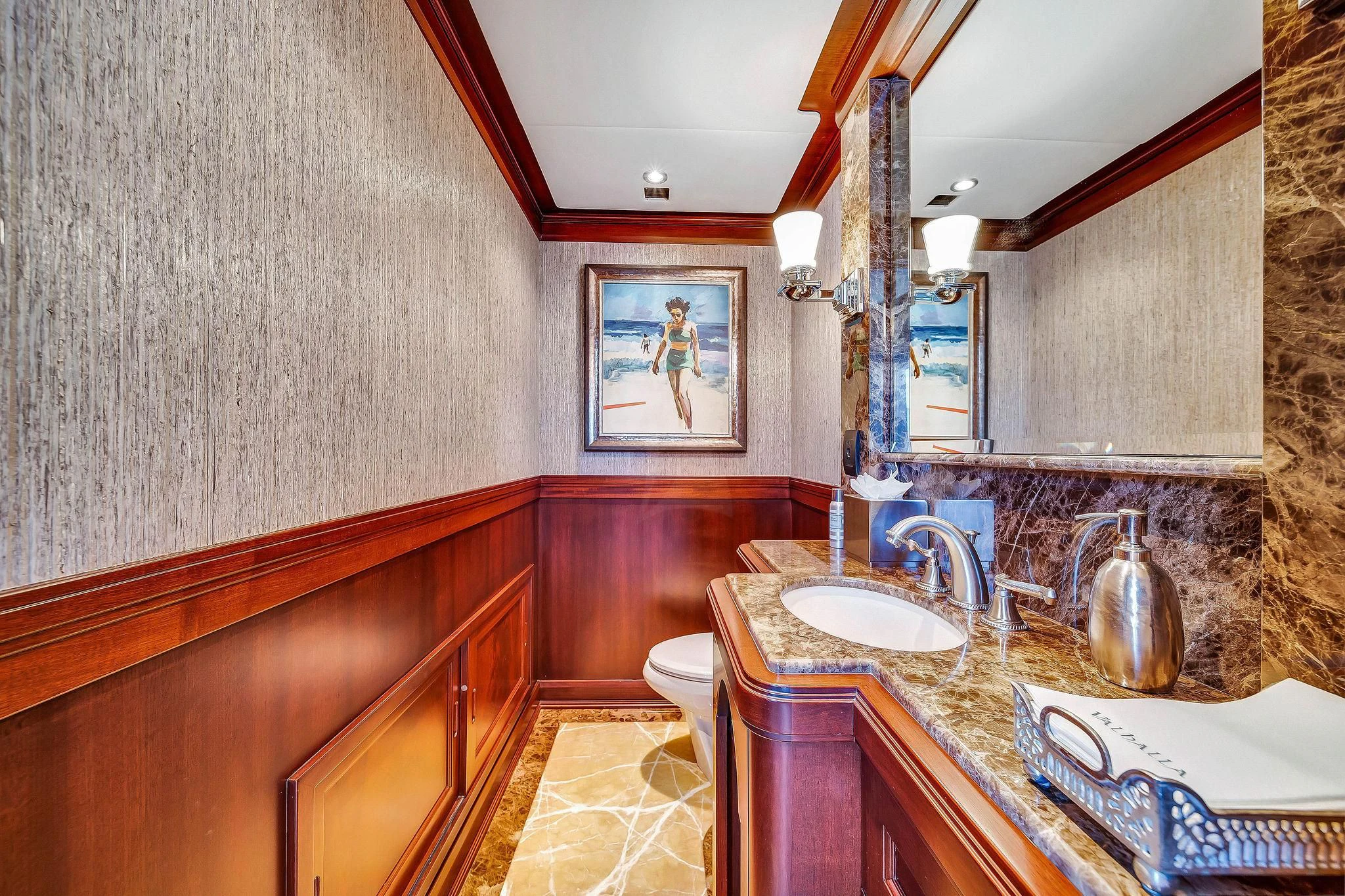 a bathroom with a sink and a mirror aboard VALHALLA Yacht for Sale