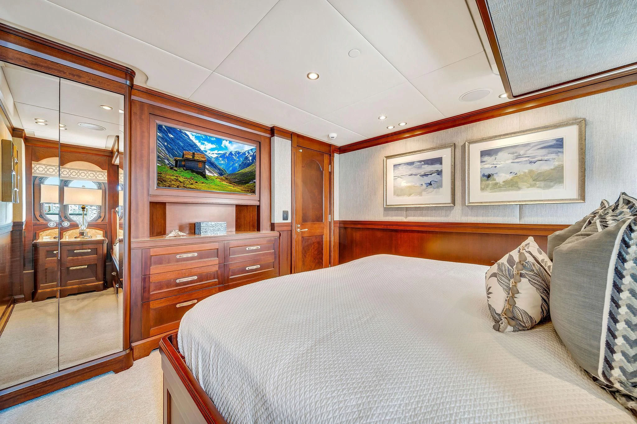 a bedroom with a bed and a closet aboard VALHALLA Yacht for Sale