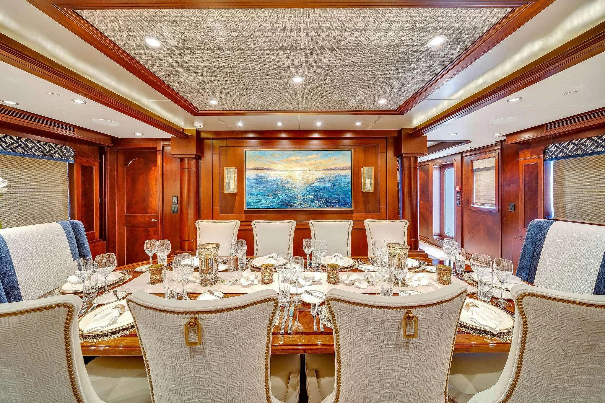 a room with tables and chairs aboard VALHALLA Yacht for Sale