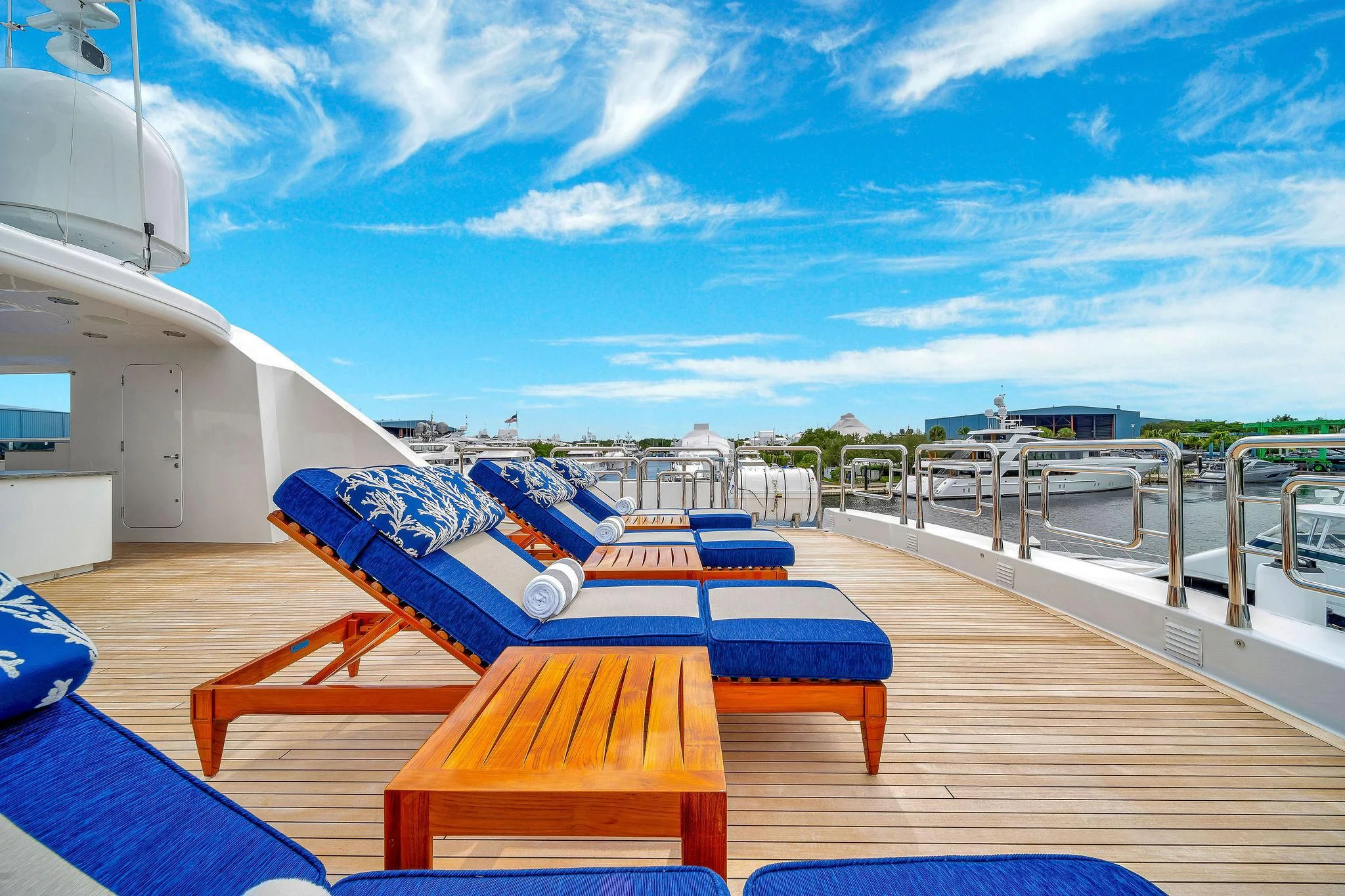 a deck with chairs and tables aboard VALHALLA Yacht for Sale