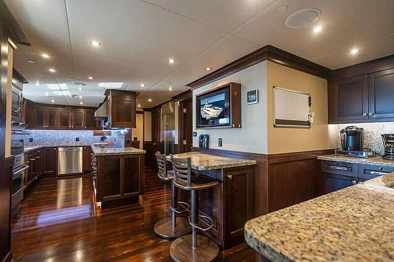 a kitchen with a large island aboard VALHALLA Yacht for Sale