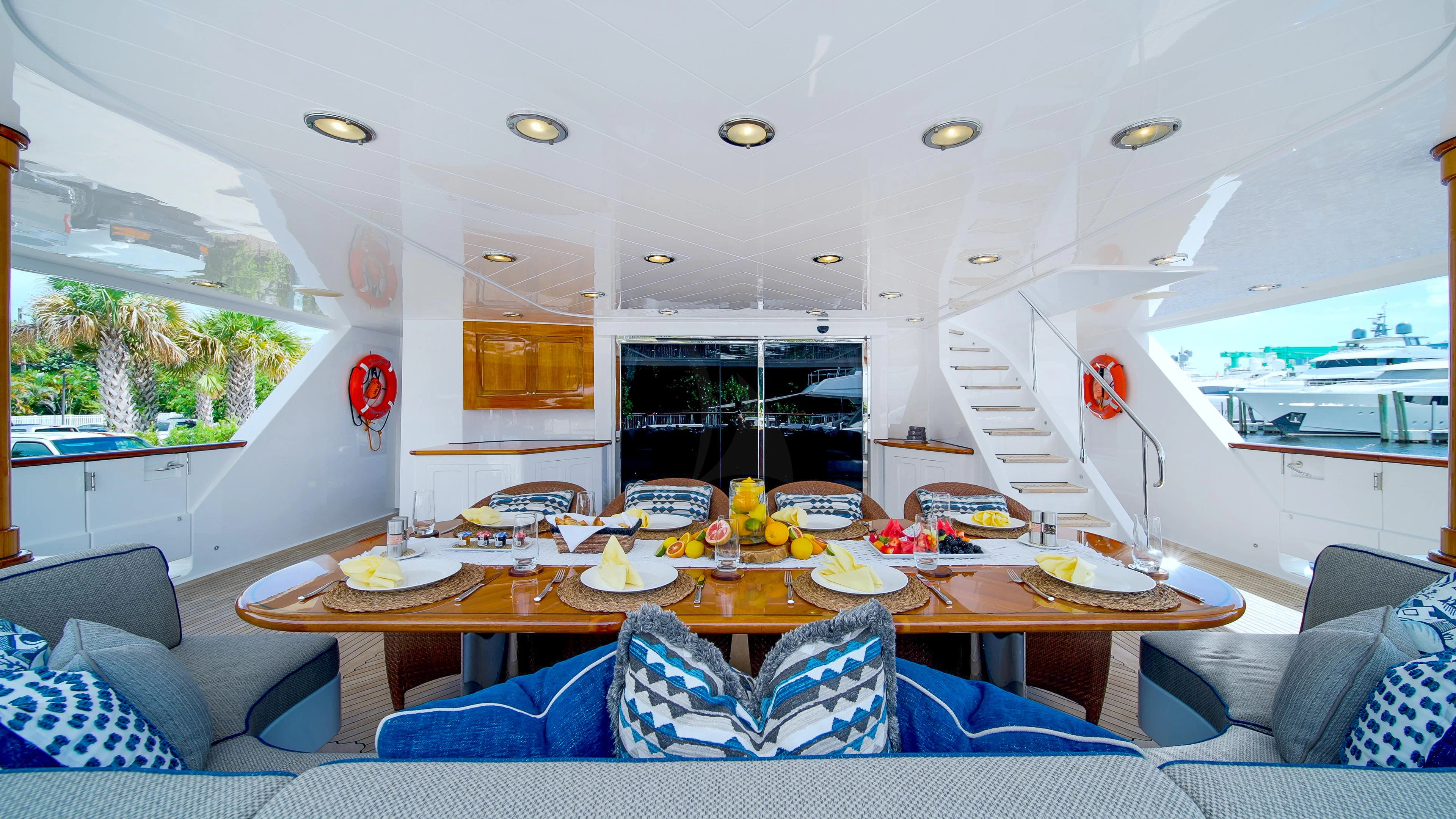 a living room with a large table and chairs aboard VALHALLA Yacht for Sale