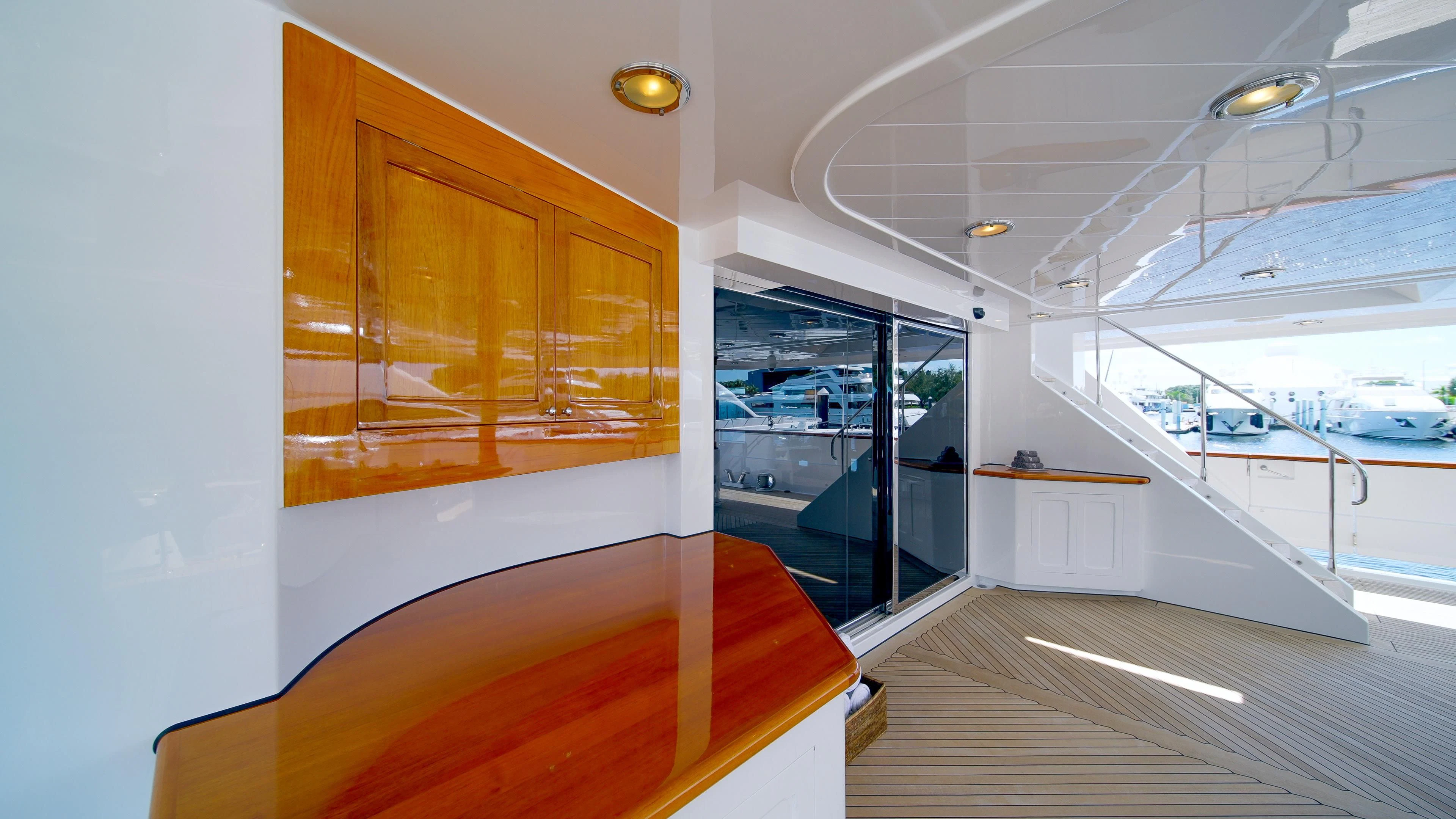 a room with a glass door and a wood floor aboard VALHALLA Yacht for Sale