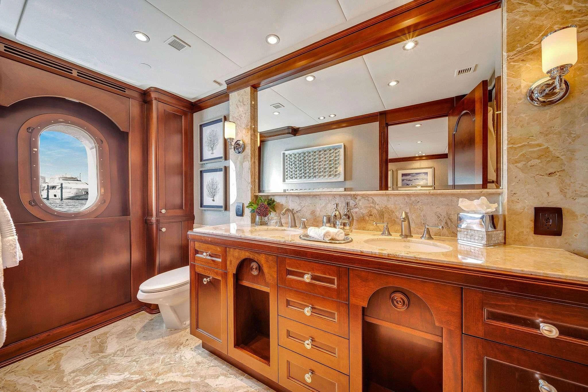 a bathroom with a large mirror aboard VALHALLA Yacht for Sale