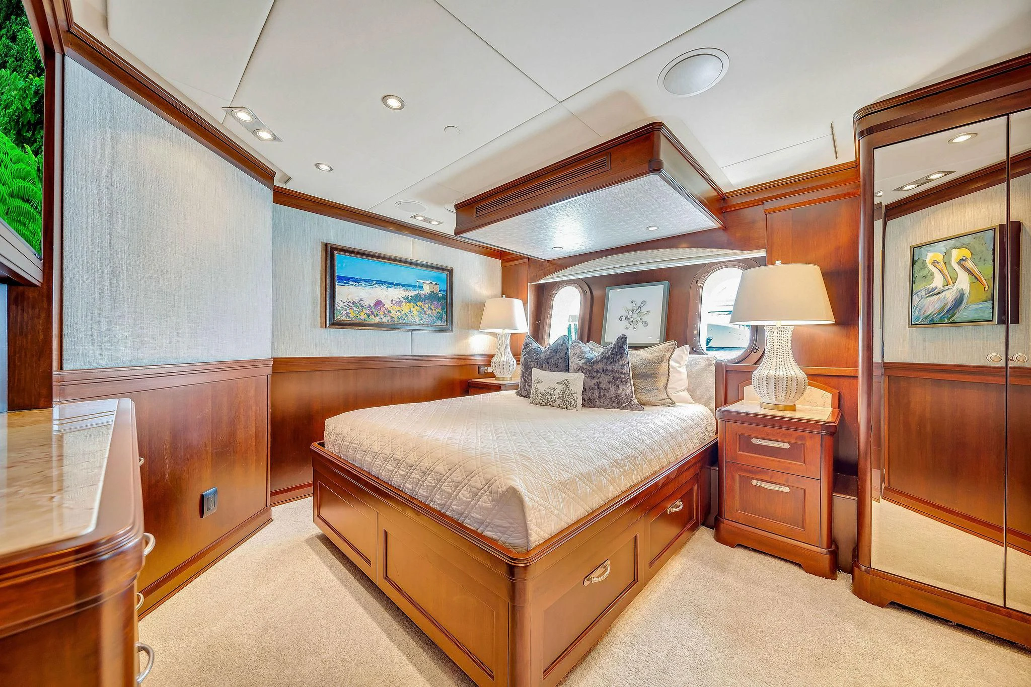 a bedroom with a bed and a lamp aboard VALHALLA Yacht for Sale