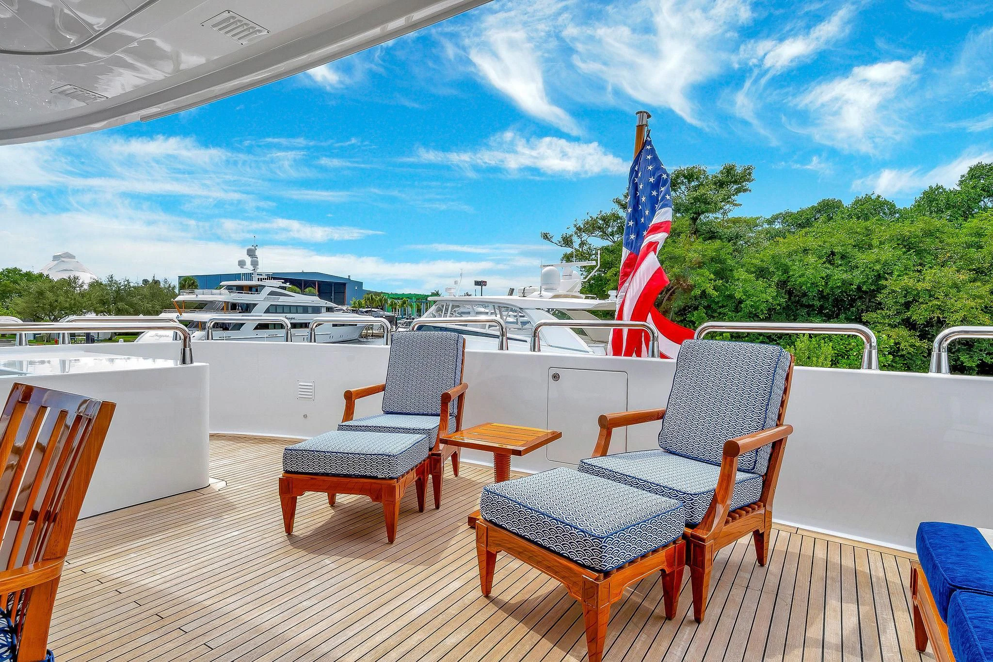 a deck with chairs and tables aboard VALHALLA Yacht for Sale