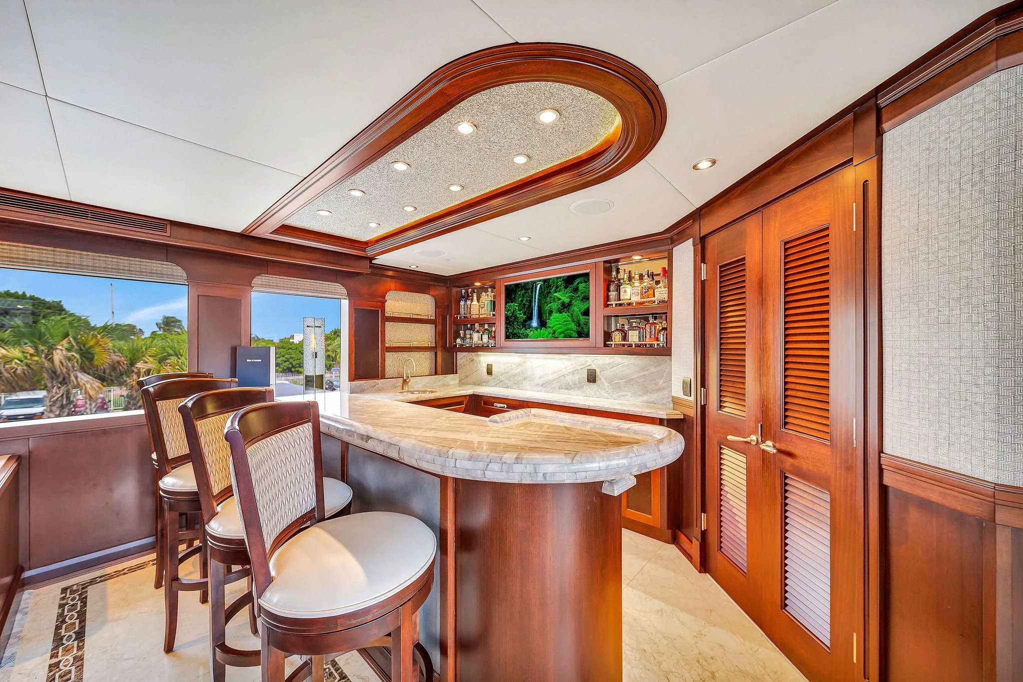a kitchen with a table and chairs aboard VALHALLA Yacht for Sale