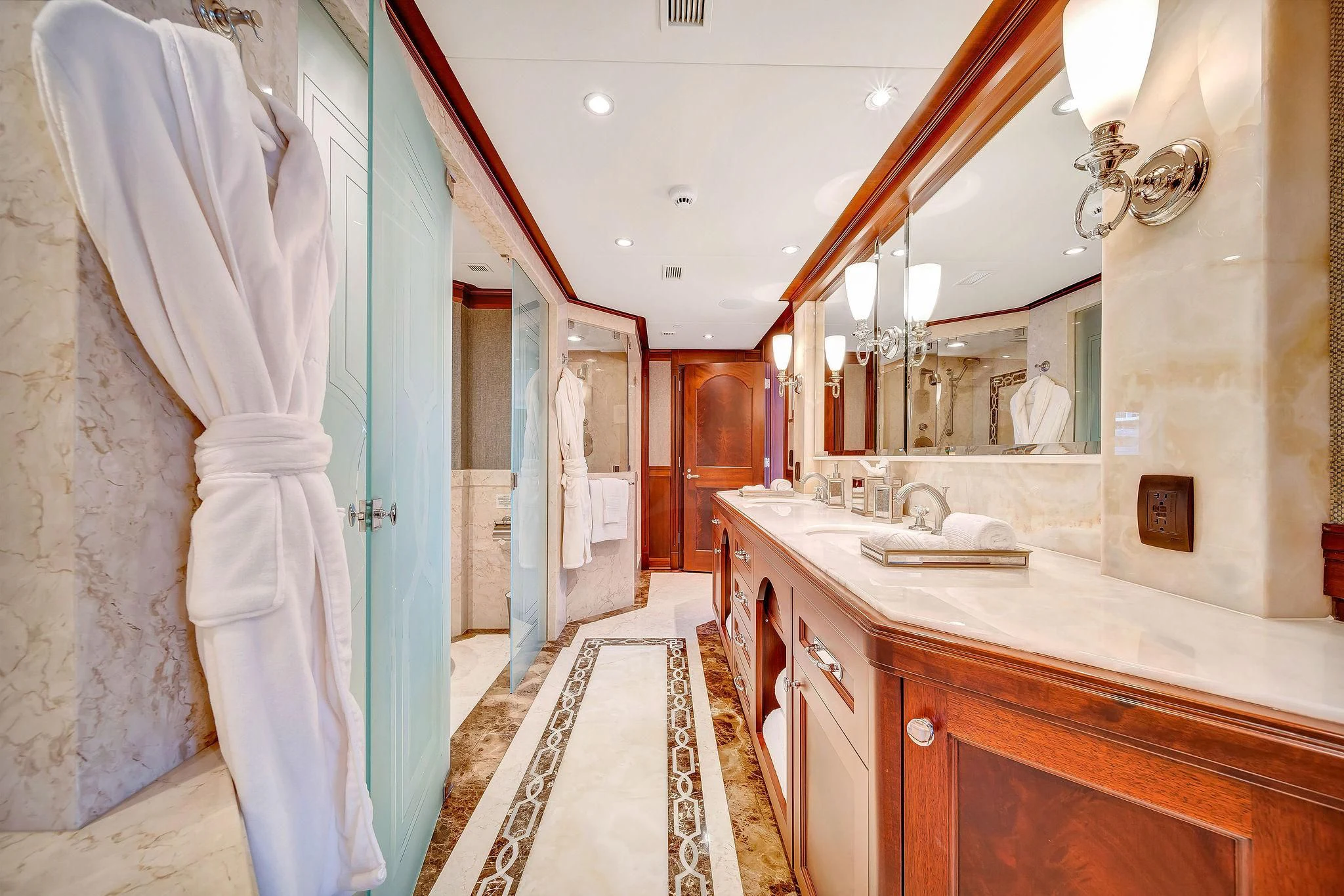 a bathroom with a large mirror aboard VALHALLA Yacht for Sale