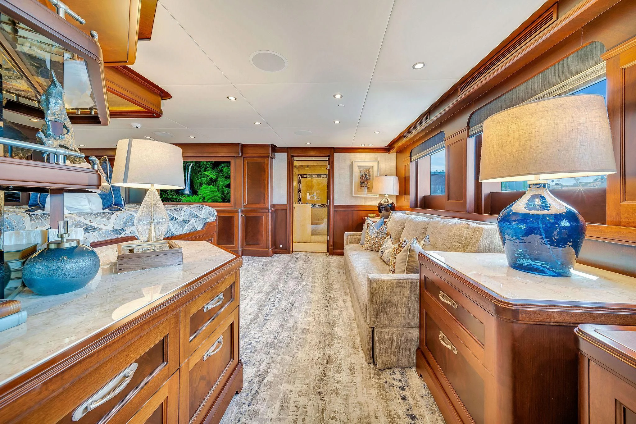 a large living room with a large mirror aboard VALHALLA Yacht for Sale