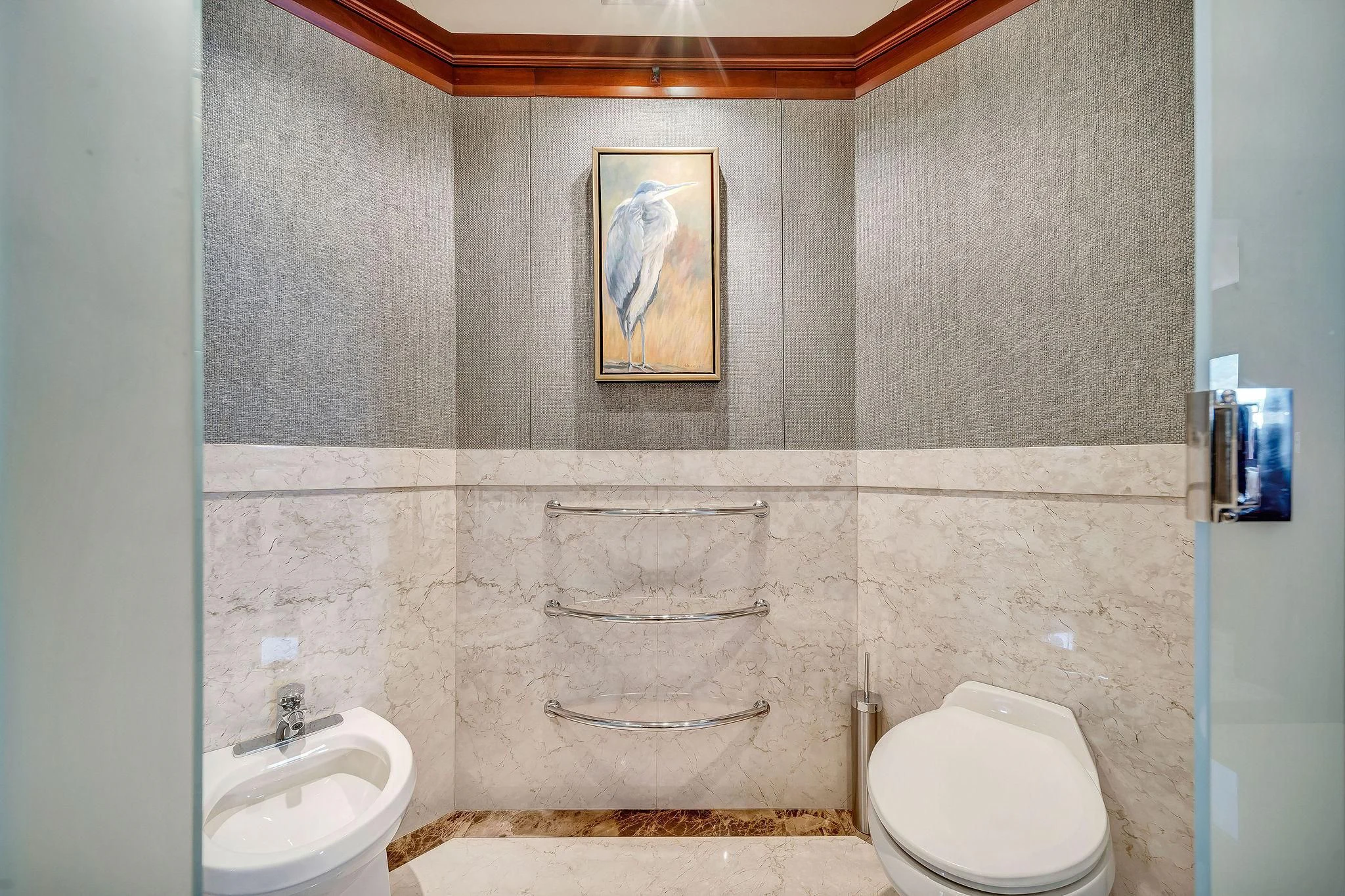 a bathroom with a painting on the wall aboard VALHALLA Yacht for Sale