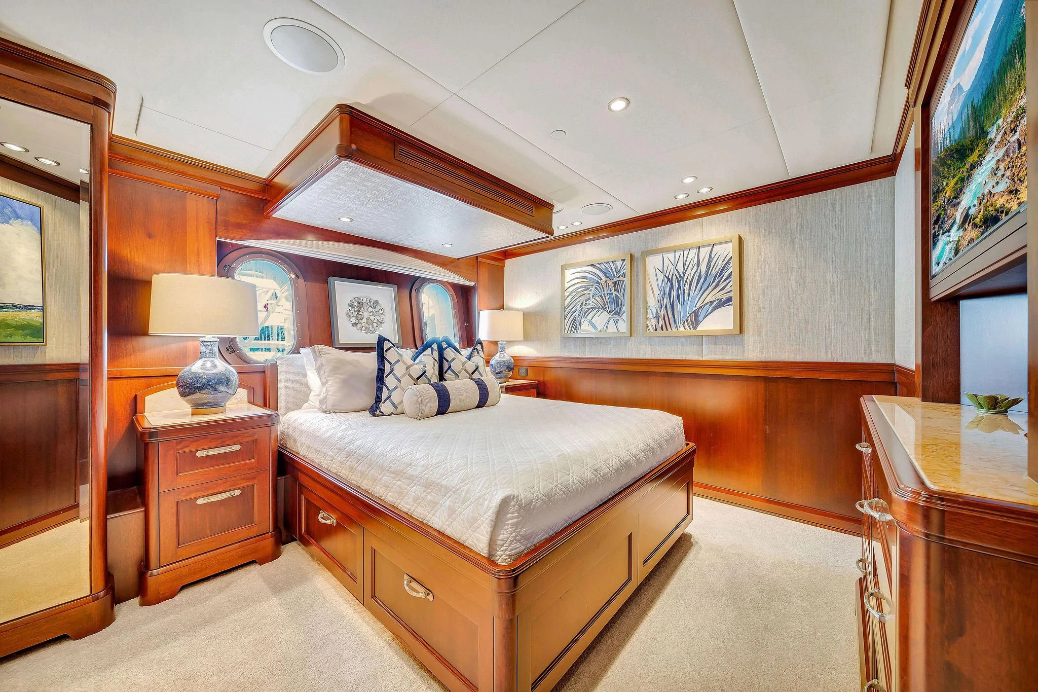 a bedroom with a bed and a desk aboard VALHALLA Yacht for Sale
