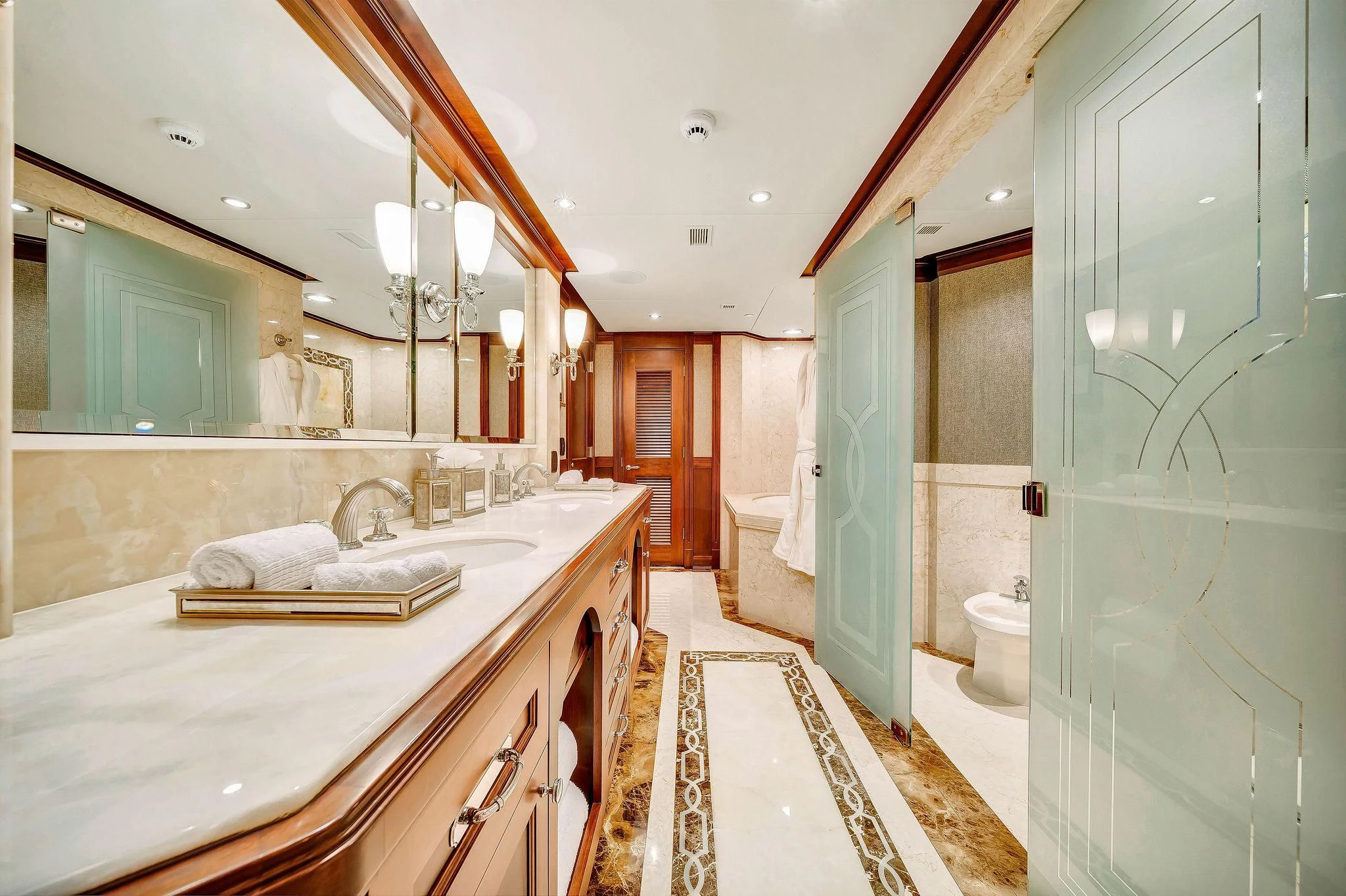 a bathroom with a tub sink and toilet aboard VALHALLA Yacht for Sale