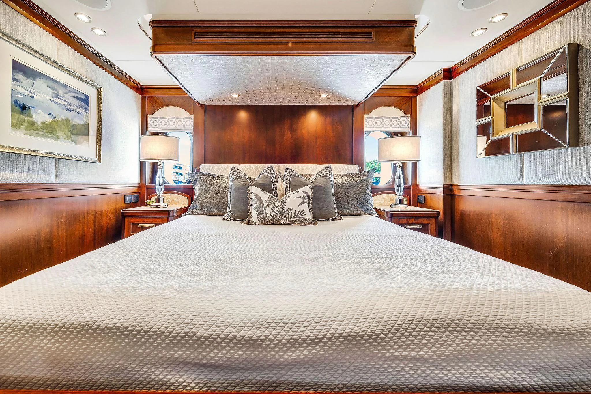 a bed with a white comforter aboard VALHALLA Yacht for Sale