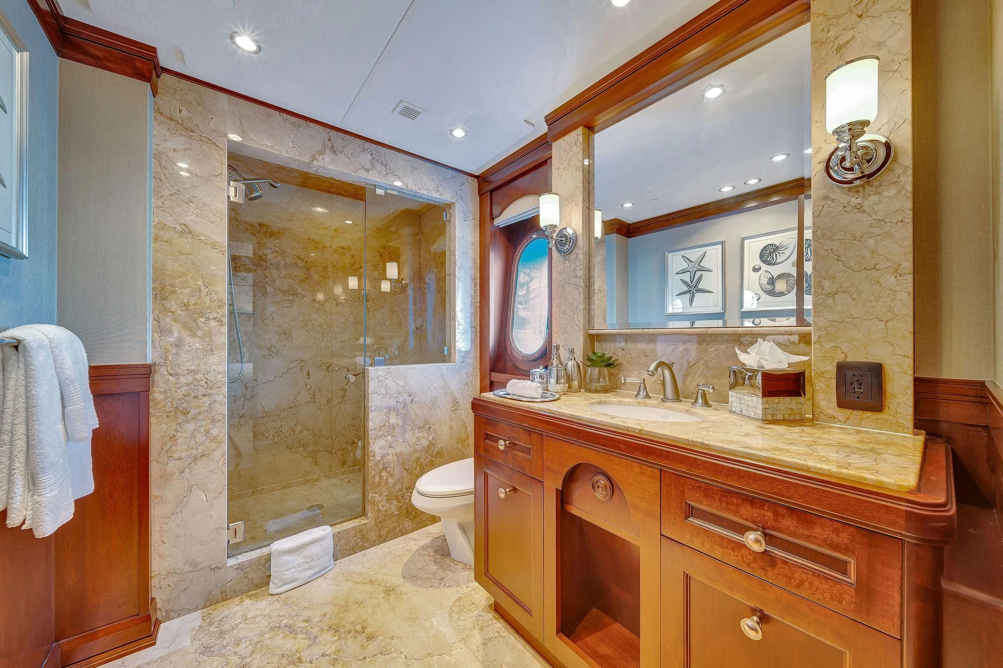 a bathroom with a glass shower aboard VALHALLA Yacht for Sale