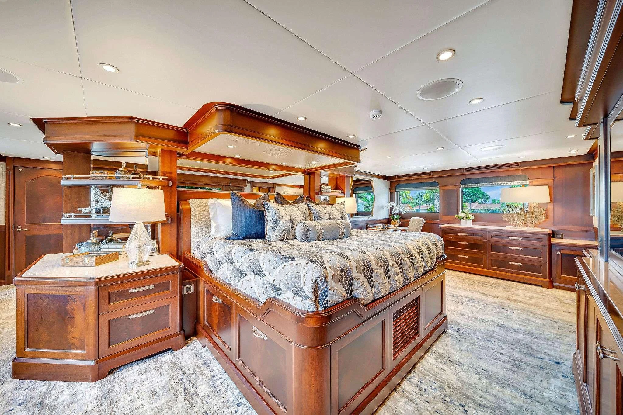 a bedroom with a bed and a dresser aboard VALHALLA Yacht for Sale