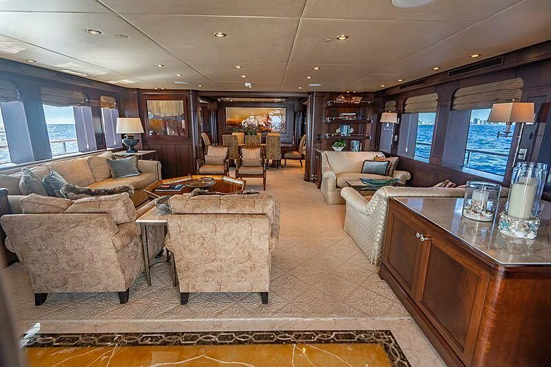 a living room with a large sofa aboard VALHALLA Yacht for Sale