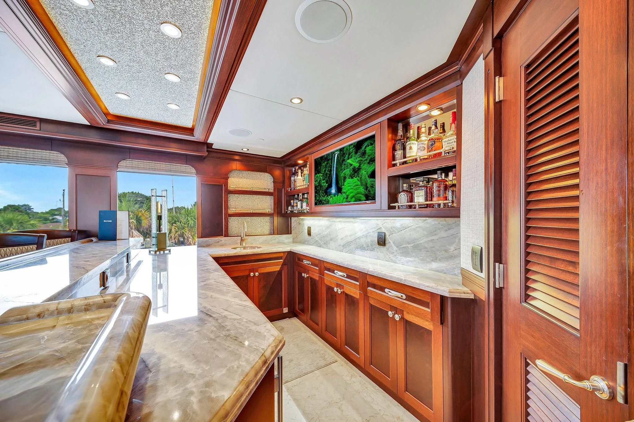 a kitchen with wooden cabinets aboard VALHALLA Yacht for Sale