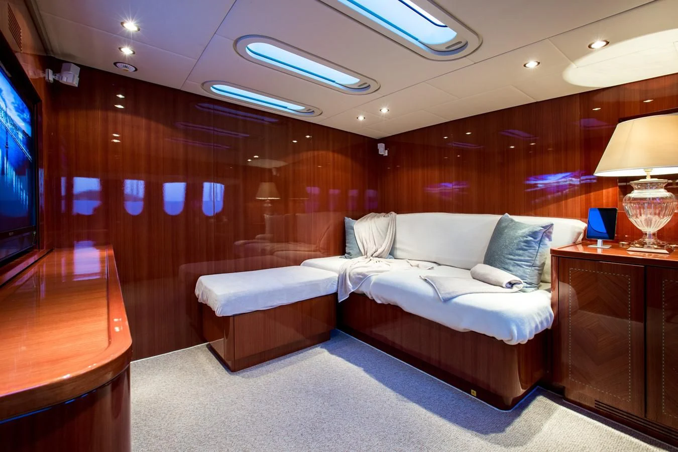 a room with a bed and a television aboard KIDI ONE Yacht for Sale