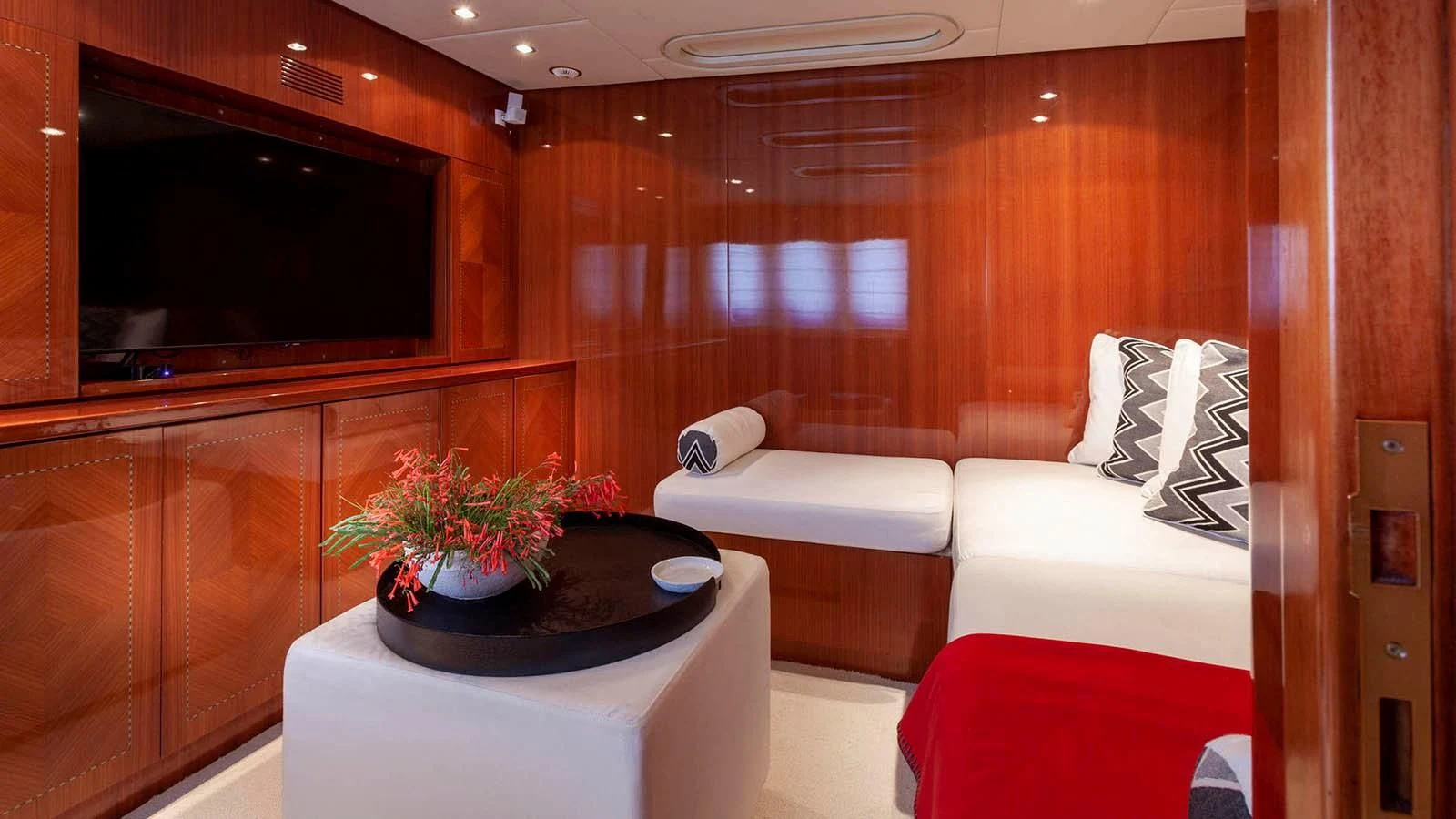 a living room with a couch and a television aboard KIDI ONE Yacht for Sale