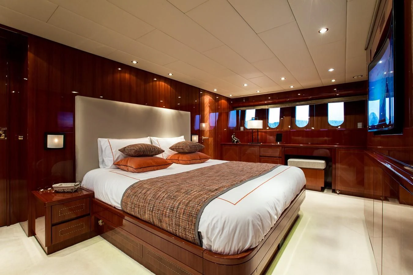 a room with a bed and a tv on the wall aboard KIDI ONE Yacht for Sale