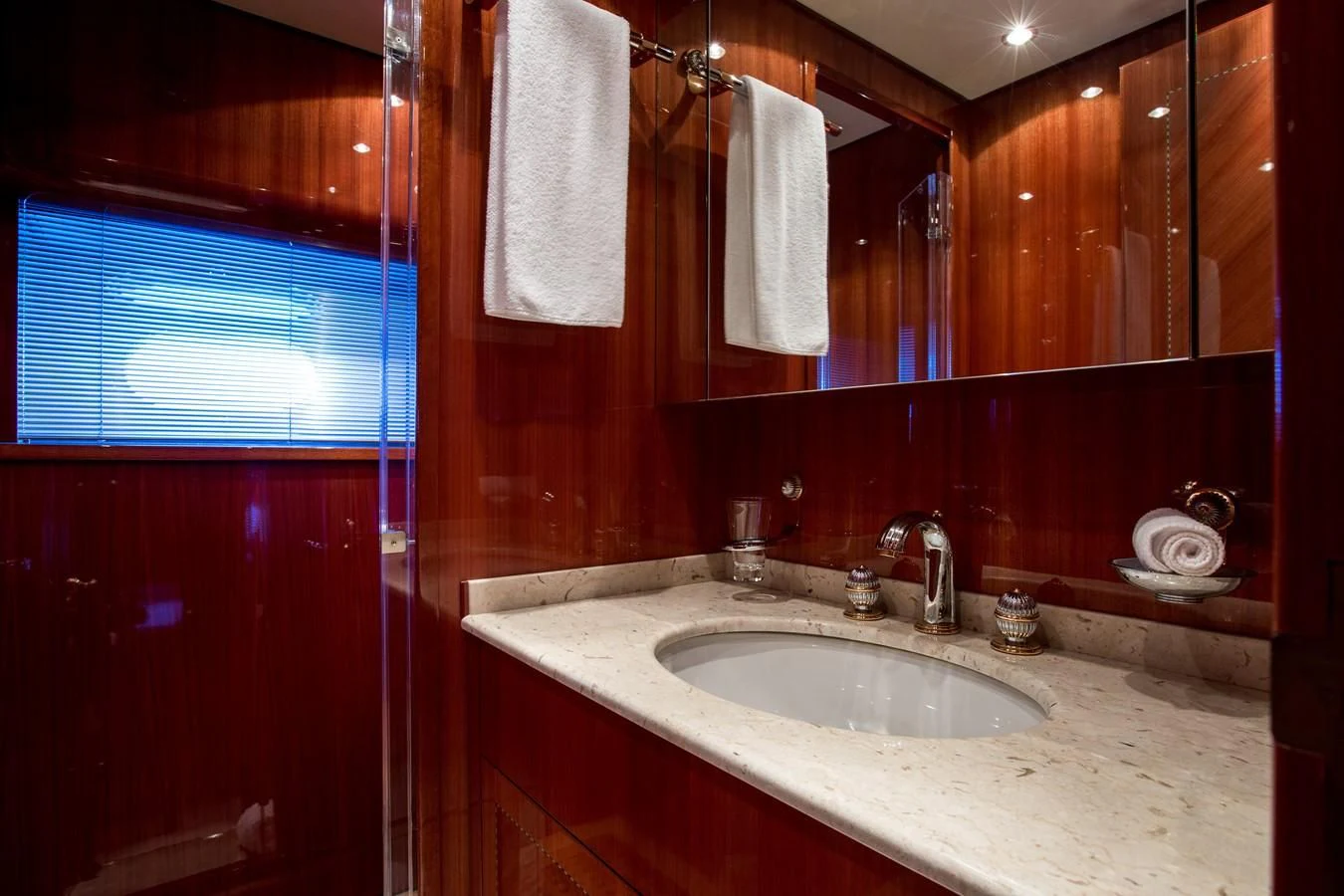 a bathroom with a sink and a mirror aboard KIDI ONE Yacht for Sale