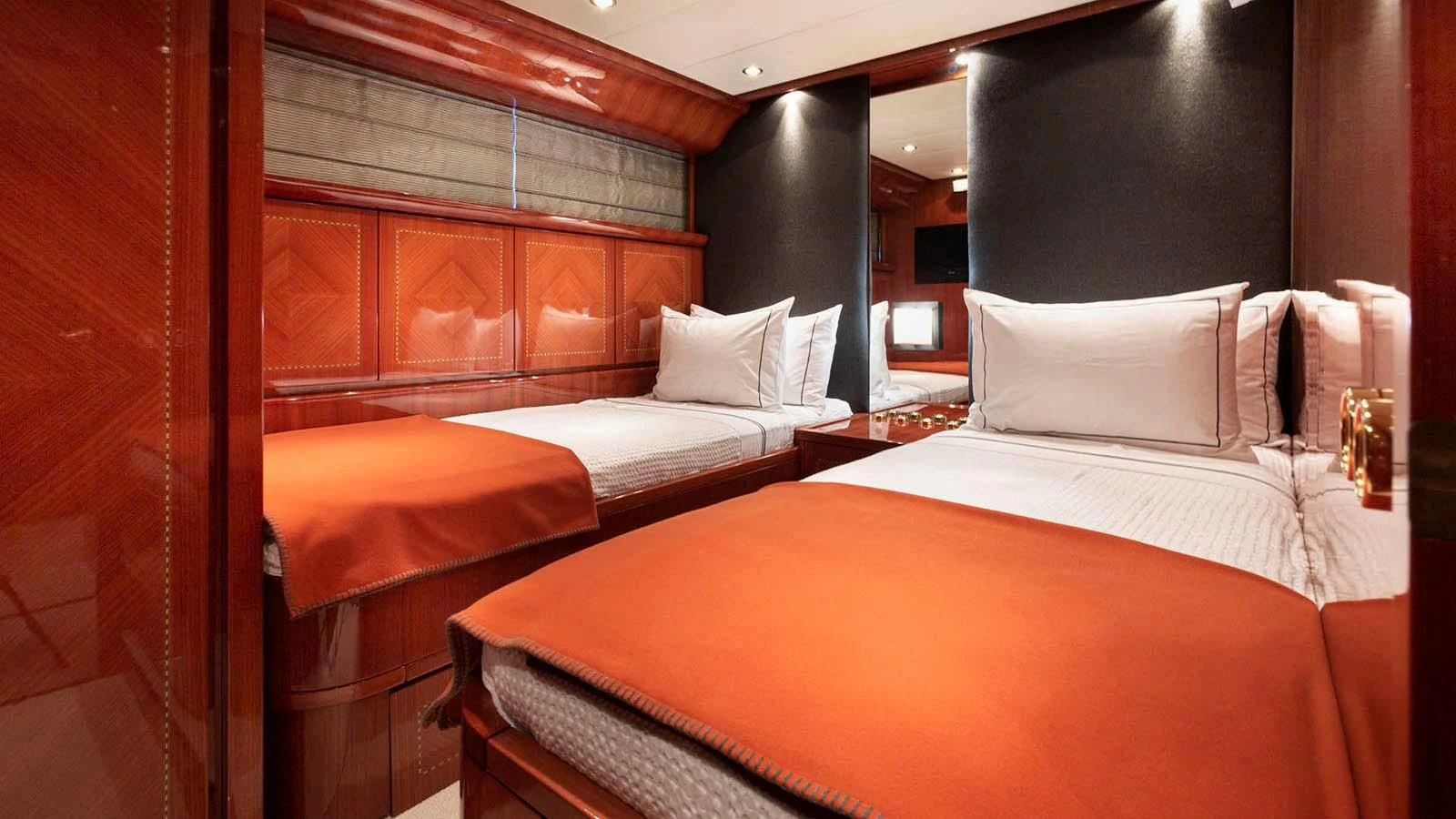 a room with beds and a wood wall aboard KIDI ONE Yacht for Sale